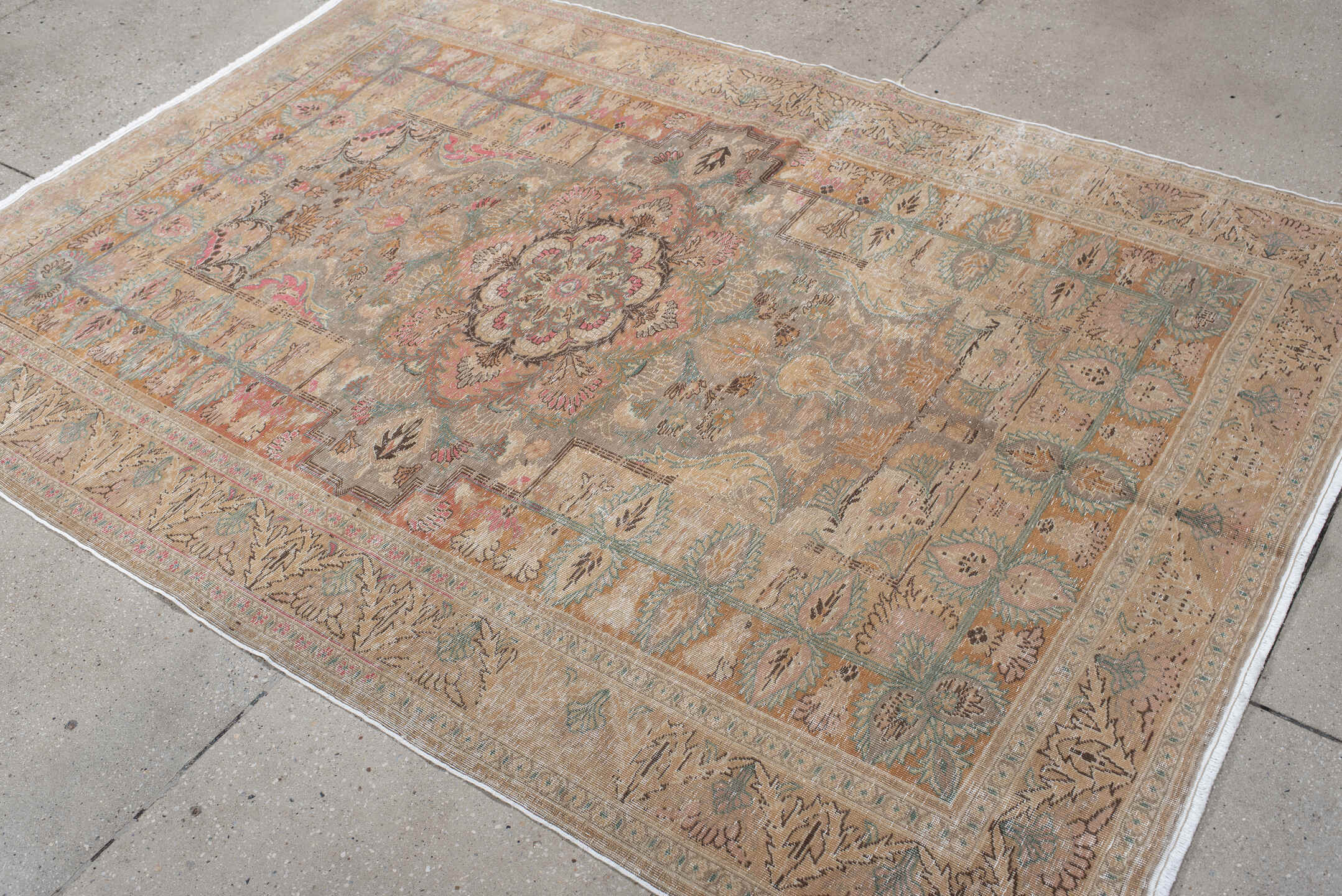5' x 7' one-of-a-kind handmade antique Hereke rug. Color palette: blush, ivory, celadon, peach, coral, taupe, sage, brown