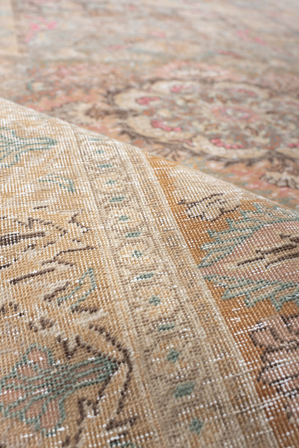 5' x 7' one-of-a-kind handmade antique Hereke rug. Color palette: blush, ivory, celadon, peach, coral, taupe, sage, brown