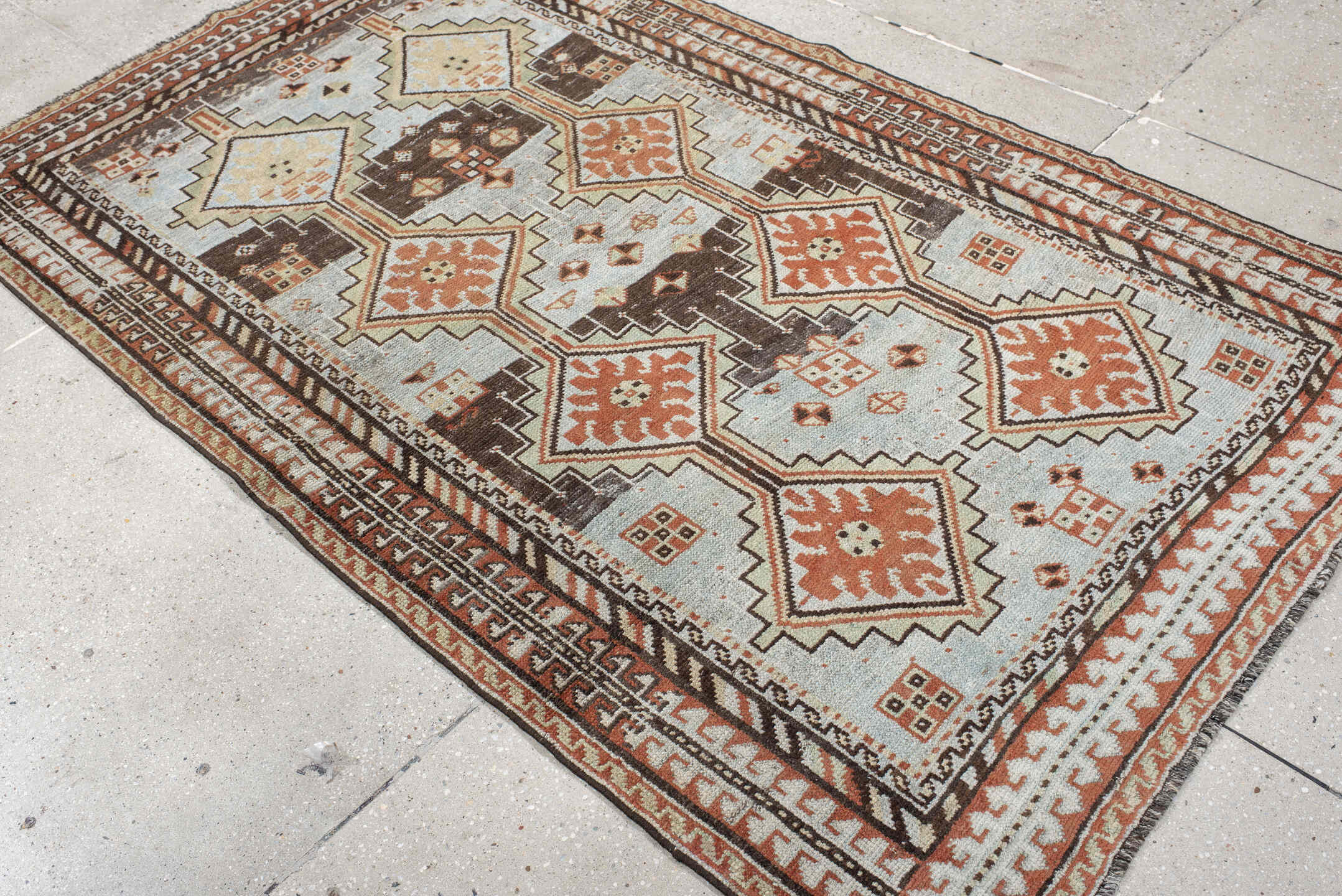 4' x 6' one-of-a-kind handmade vintage Gabbe rug. Color palette: ivory, rust, brown, charcoal, camel, pale blue, terracotta