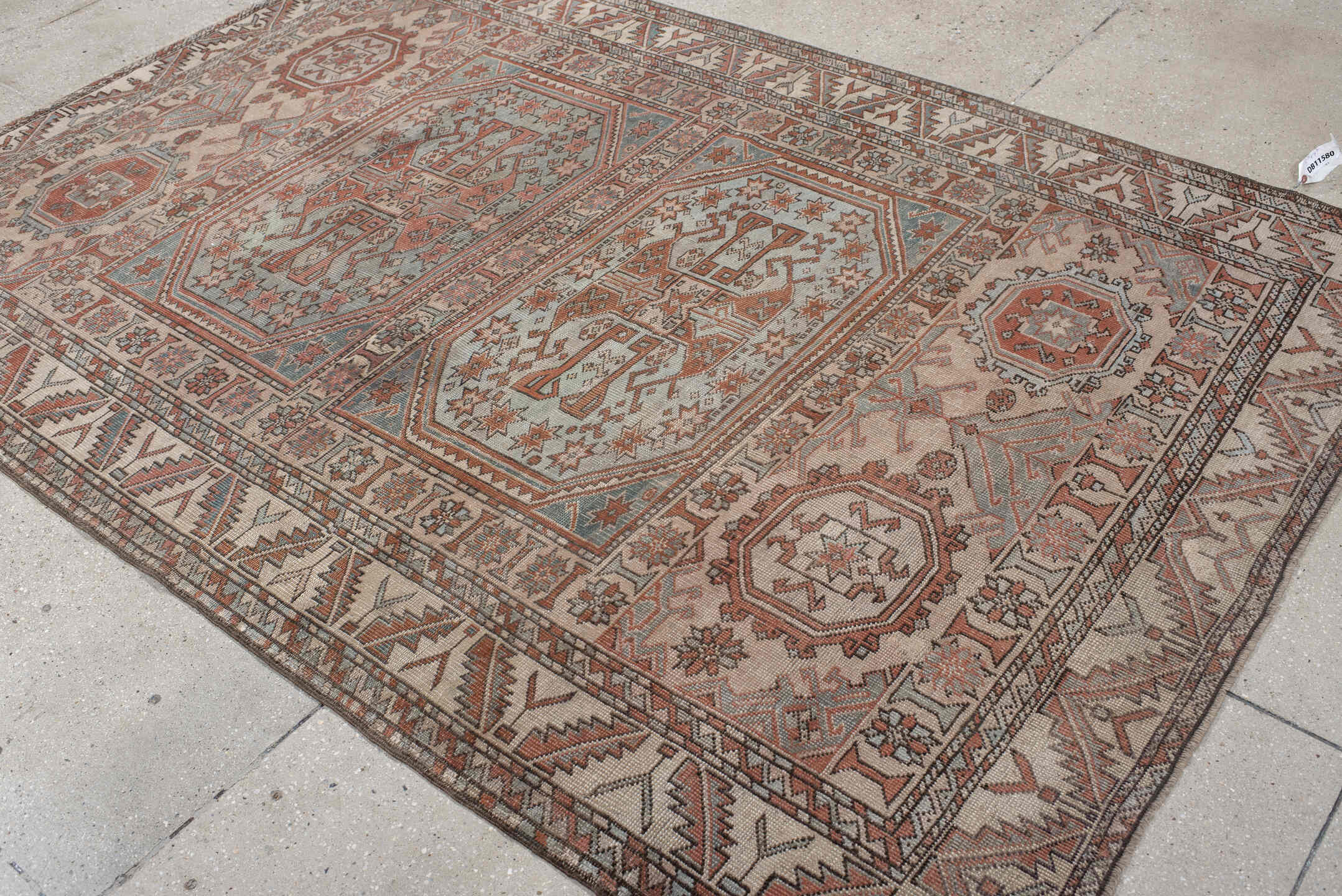 5' x 7' one-of-a-kind handmade antique Anatolian rug. Color palette: ivory, rust, blue_gray, charcoal, terracotta, taupe