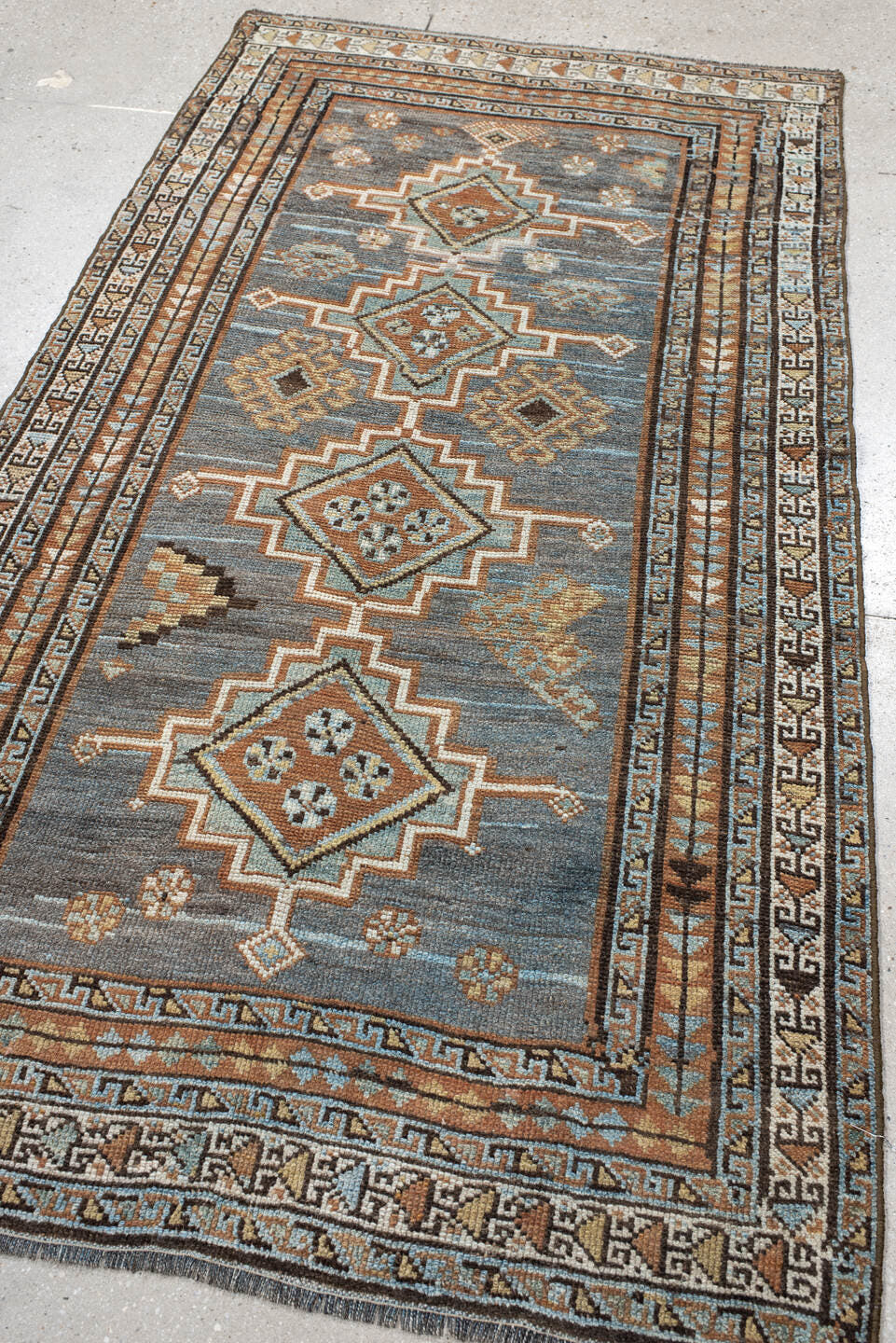 3' x 7' one-of-a-kind handmade antique Gabbe rug. Color palette: blue, rust, ivory, brown, camel, teal, charcoal, terracotta