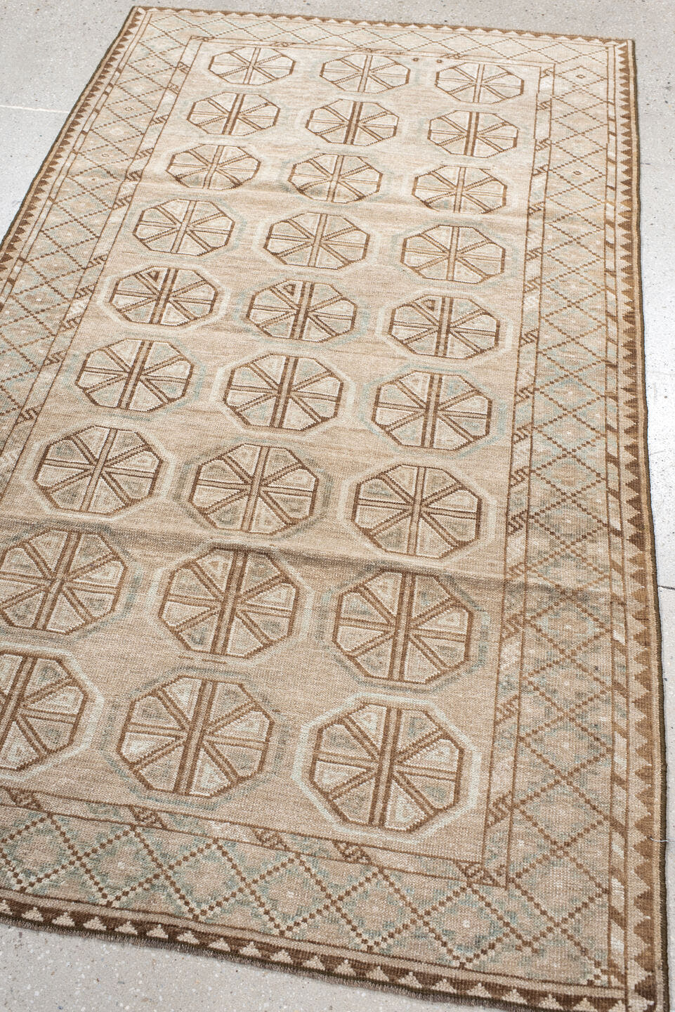 3' x 6' one-of-a-kind handmade antique Belouch rug. Color palette: ivory, camel, taupe, brown, pale blue, beige, gray