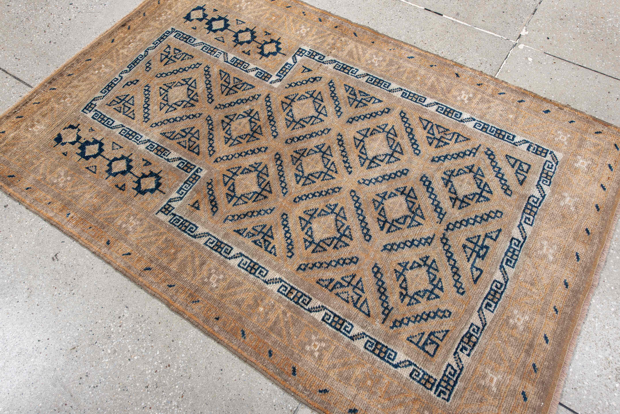 3' x 5' one-of-a-kind handmade antique Belouch small size rug. Color palette: camel, indigo, ivory, taupe, sand, beige
