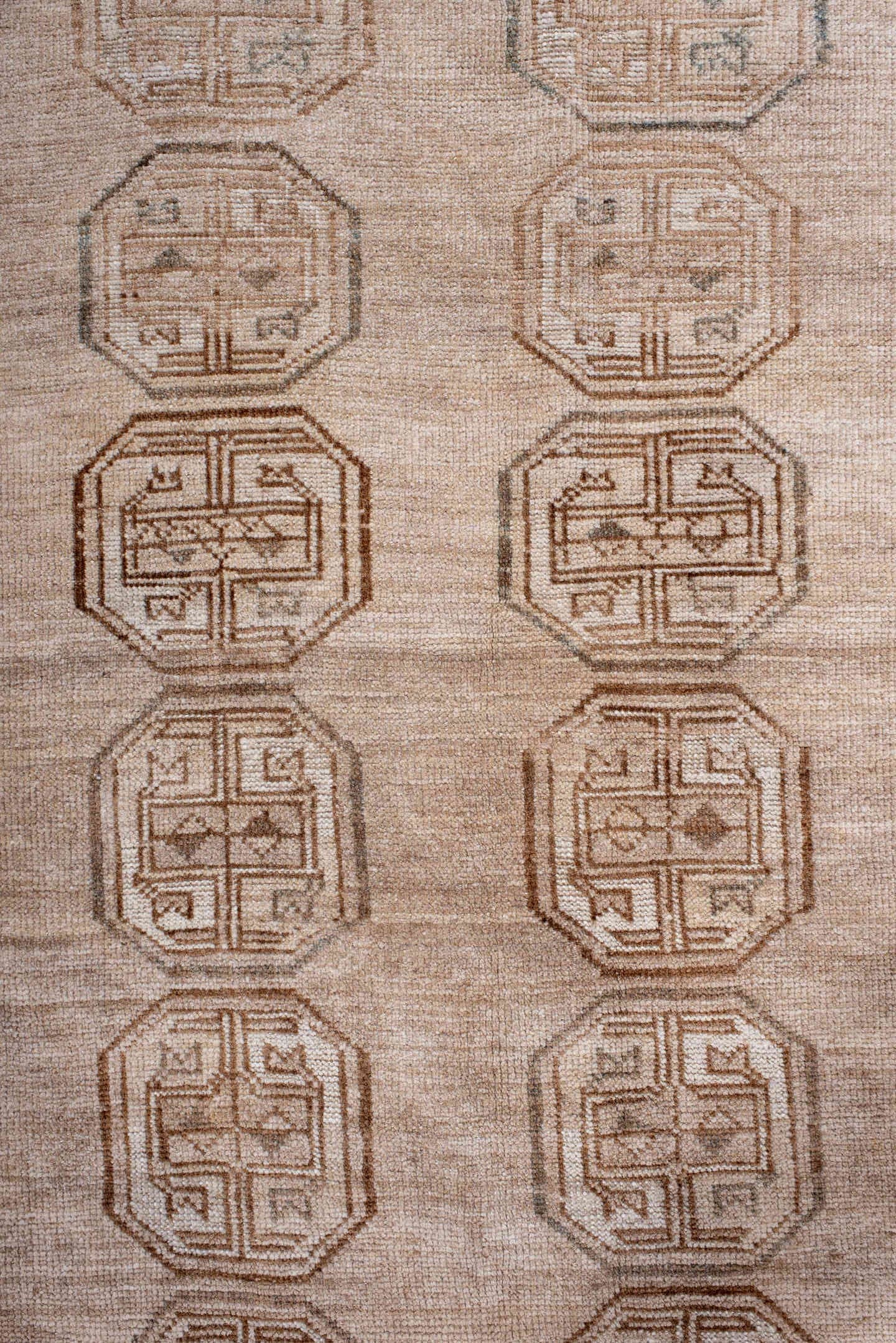 5' x 7' one-of-a-kind handmade antique Afghan rug. Color palette: ivory, taupe, camel, sand, brown, slate, beige, gray