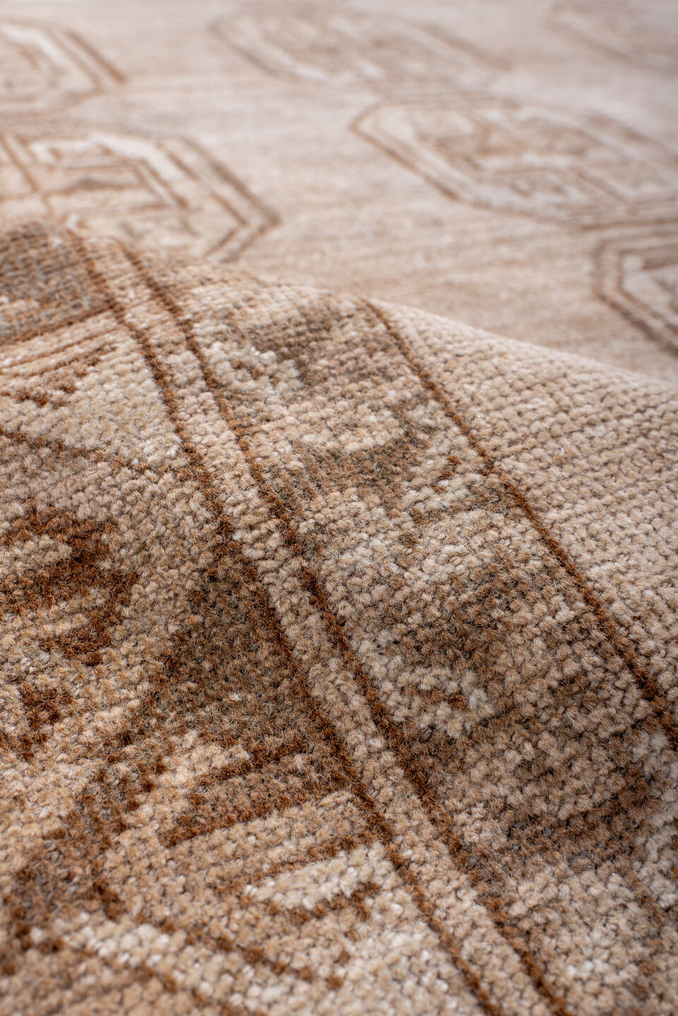 5' x 7' one-of-a-kind handmade antique Afghan rug. Color palette: ivory, taupe, camel, sand, brown, slate, beige, gray
