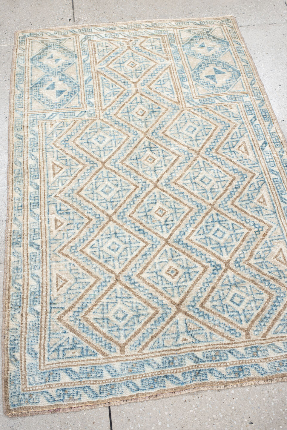 3' x 4' one-of-a-kind handmade antique Belouch small size rug. Color palette: ivory, sky blue, camel, beige, light blue