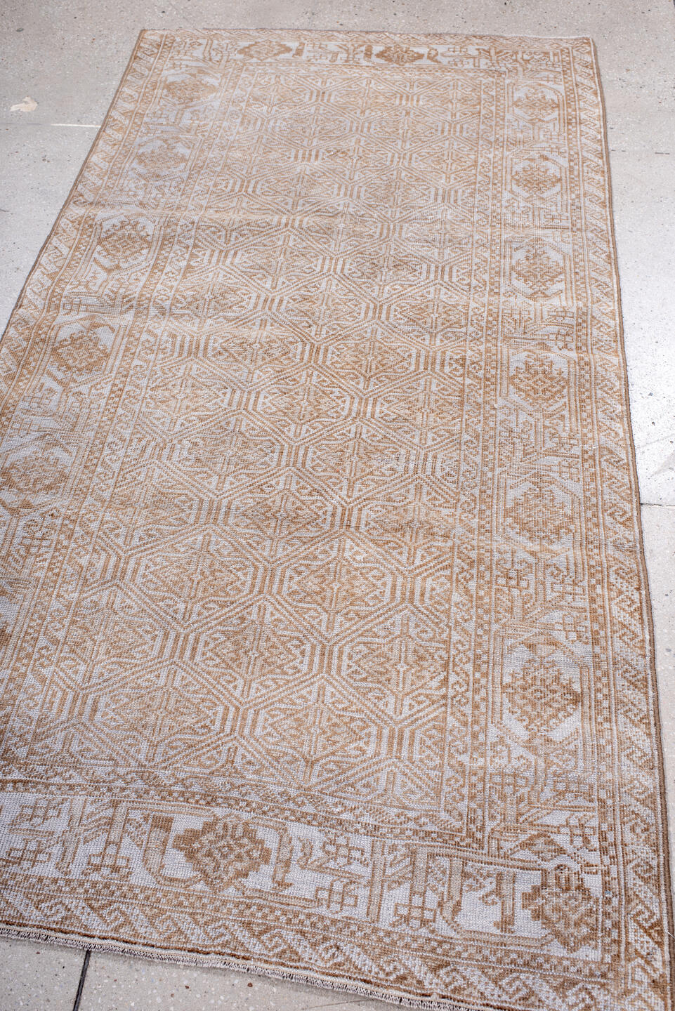 3' x 7' one-of-a-kind handmade antique Belouch rug. Color palette: ivory, camel, tan, taupe, beige, gray