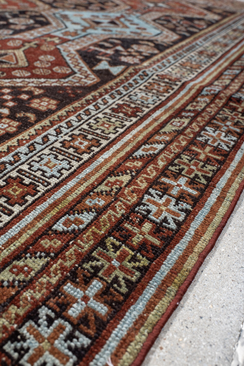 4' x 6' one-of-a-kind handmade antique Belouch small size rug. Color palette: rust, ivory, dark brown, sky blue, sage