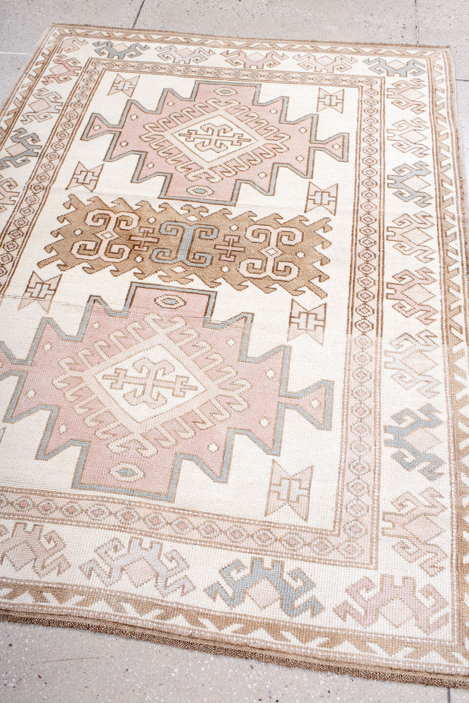 4' x 5' one-of-a-kind handmade vintage Anatolian small size rug. Color palette: ivory, blush, taupe, camel, pale blue, pink