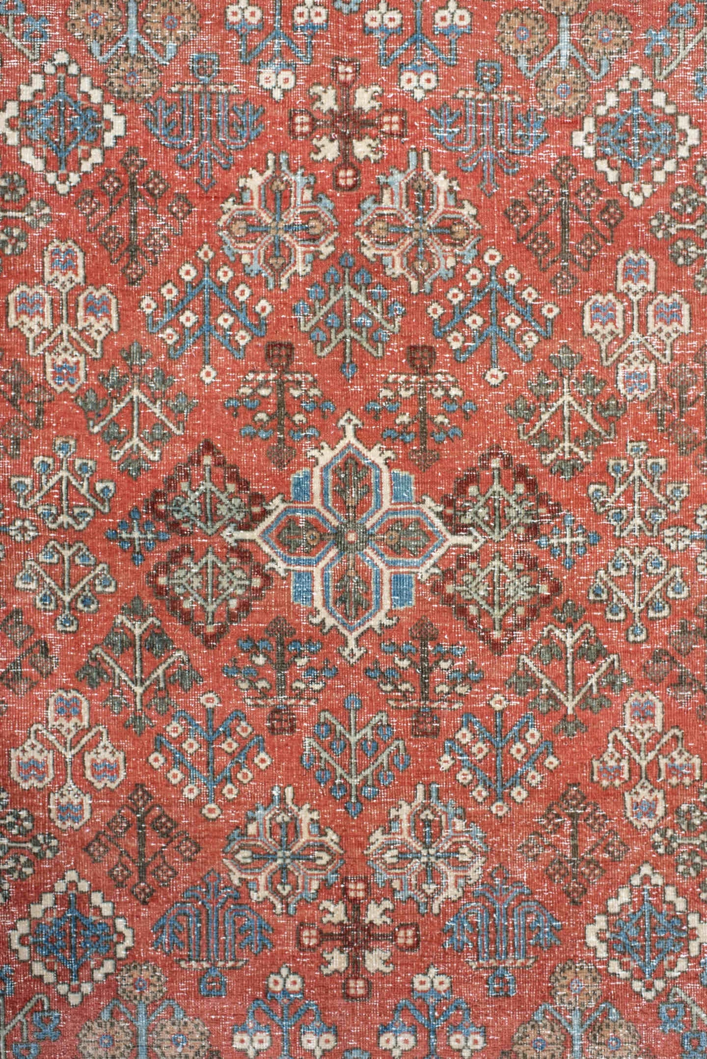 4' x 6' one-of-a-kind handmade vintage Joshegan rug. Color palette: terracotta, pale blue, ivory, slate, taupe, rust
