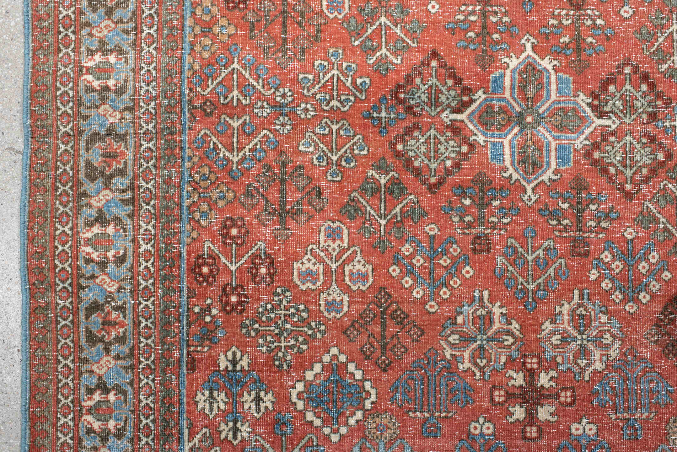 4' x 6' one-of-a-kind handmade vintage Joshegan rug. Color palette: terracotta, pale blue, ivory, slate, taupe, rust