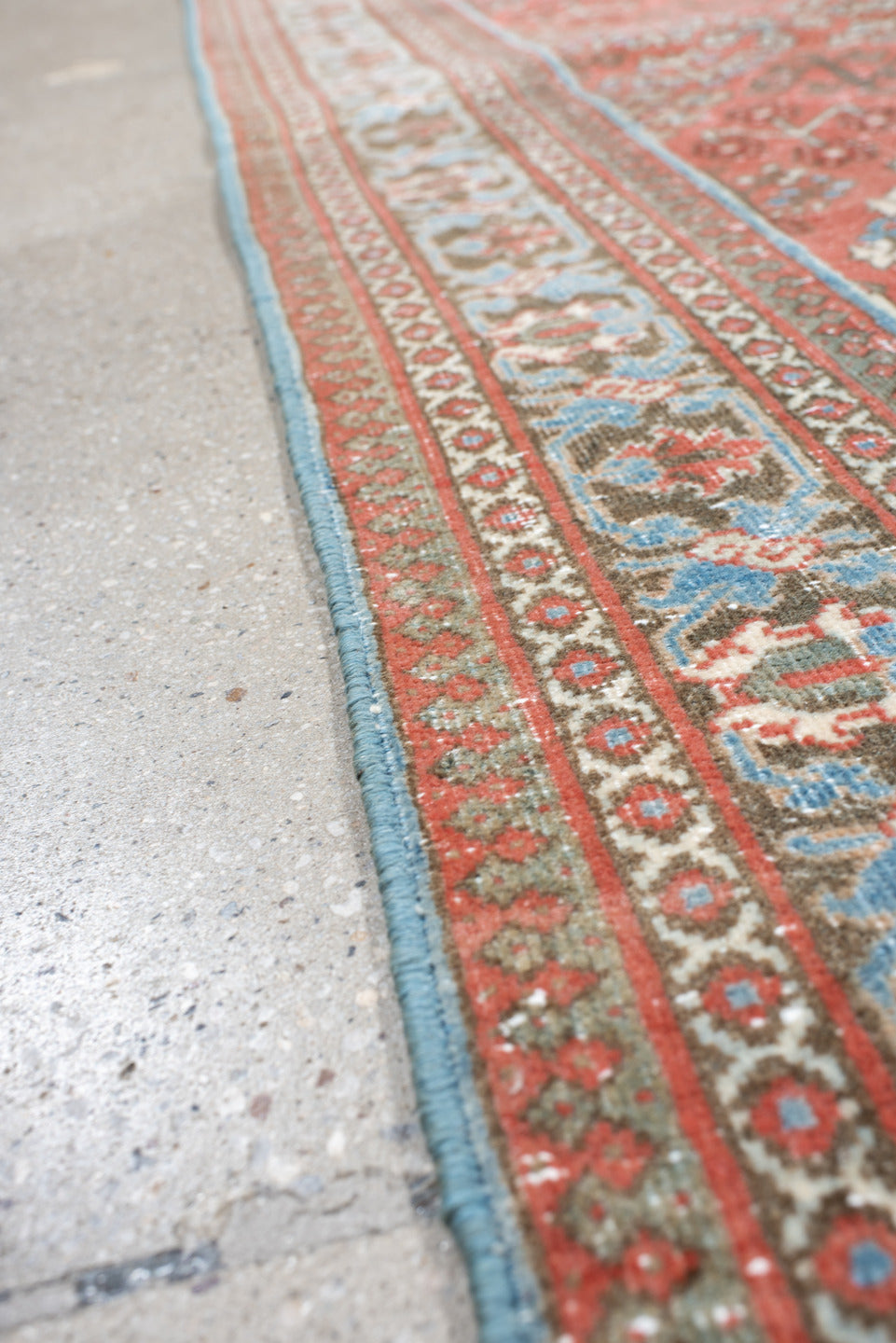 4' x 6' one-of-a-kind handmade vintage Joshegan rug. Color palette: terracotta, pale blue, ivory, slate, taupe, rust