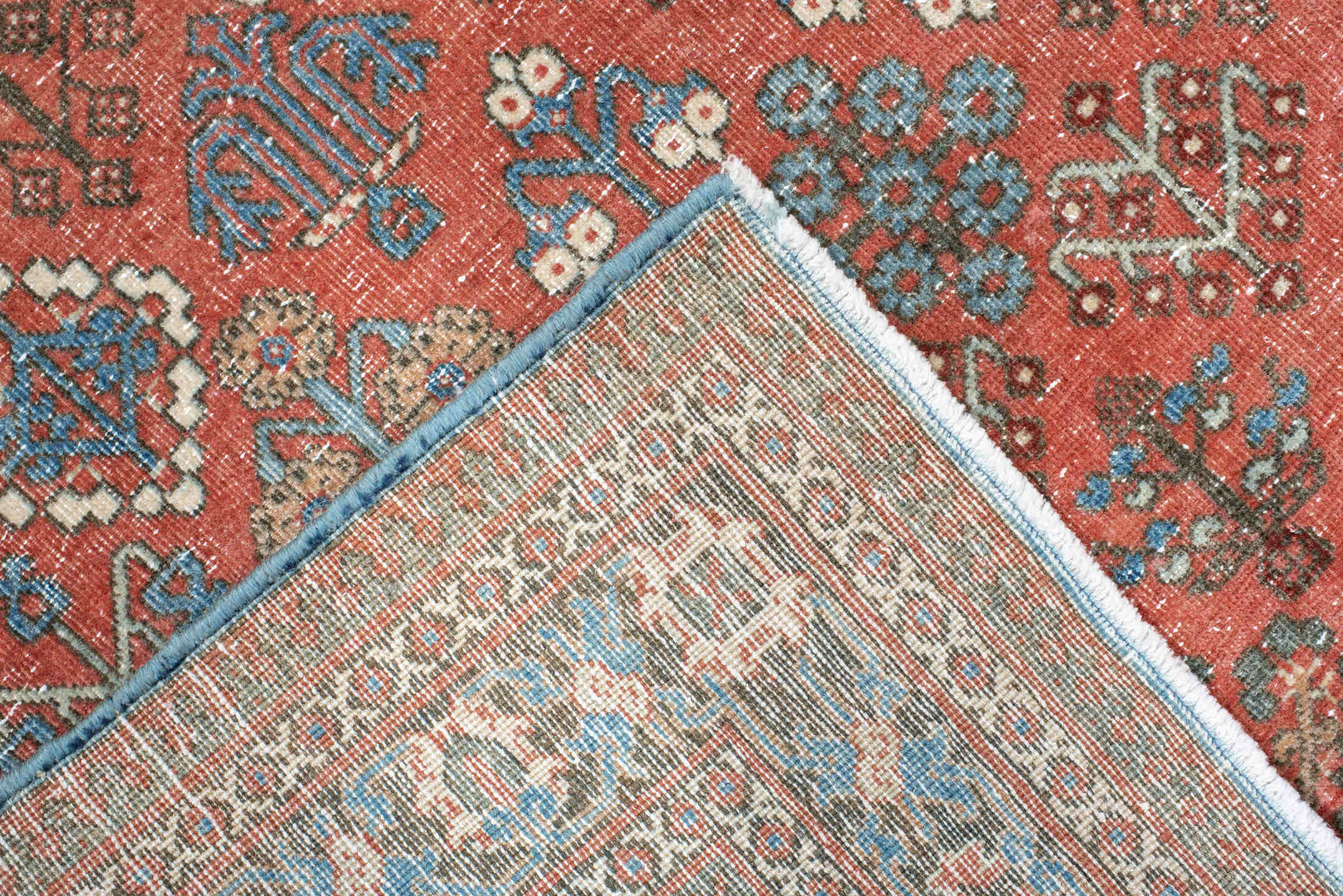 4' x 6' one-of-a-kind handmade vintage Joshegan rug. Color palette: terracotta, pale blue, ivory, slate, taupe, rust