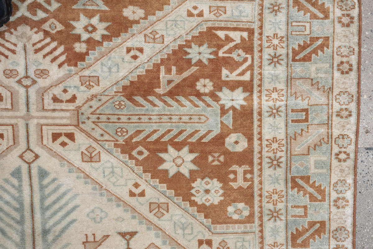 4' x 5' one-of-a-kind handmade antique Caucasian small size rug. Color palette: terra cotta, ivory, pale blue, camel, taupe
