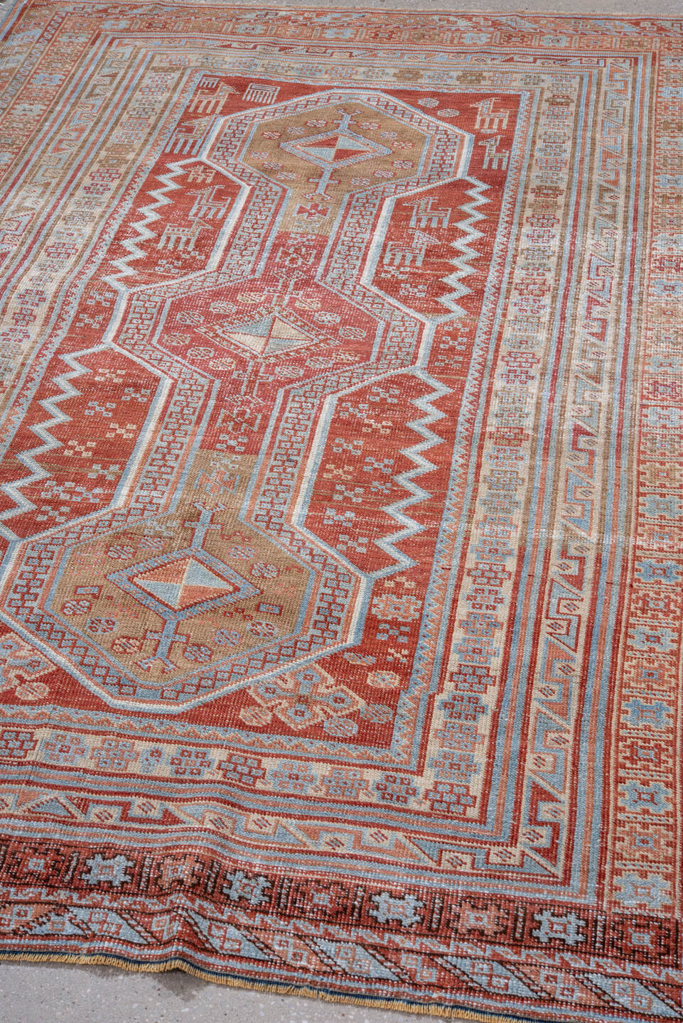 4' x 5' one-of-a-kind handmade vintage small size rug. Color palette: brown, dark red, gray, light blue, light gray, maroon