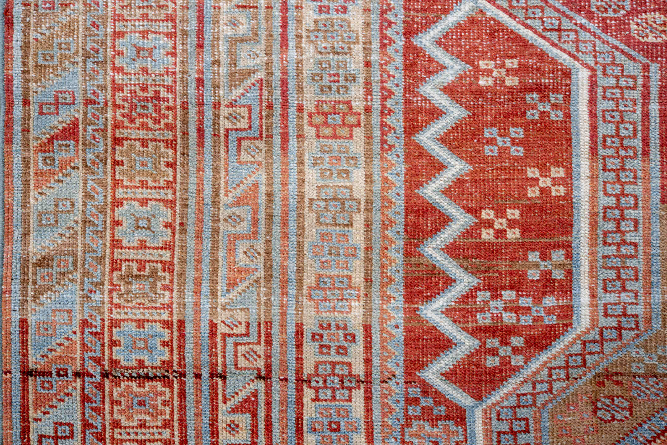 4' x 5' one-of-a-kind handmade vintage small size rug. Color palette: brown, dark red, gray, light blue, light gray, maroon