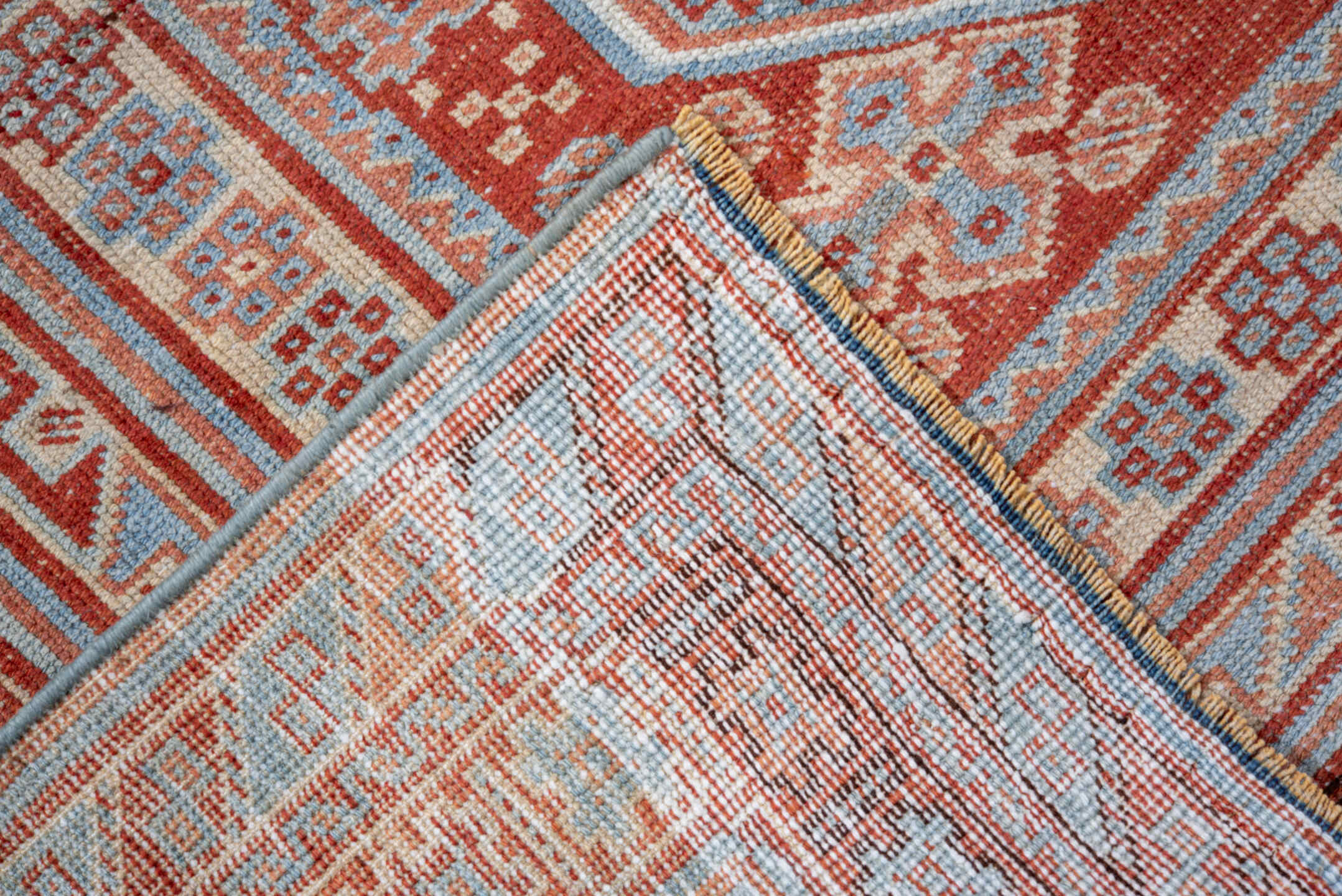 4' x 5' one-of-a-kind handmade vintage small size rug. Color palette: brown, dark red, gray, light blue, light gray, maroon
