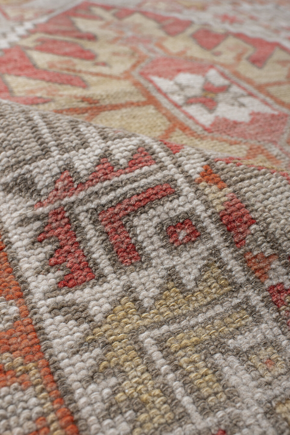 2' x 4' one-of-a-kind handmade vintage Anatolian small size rug. Color palette: ivory, coral, peach, taupe, sand, rust