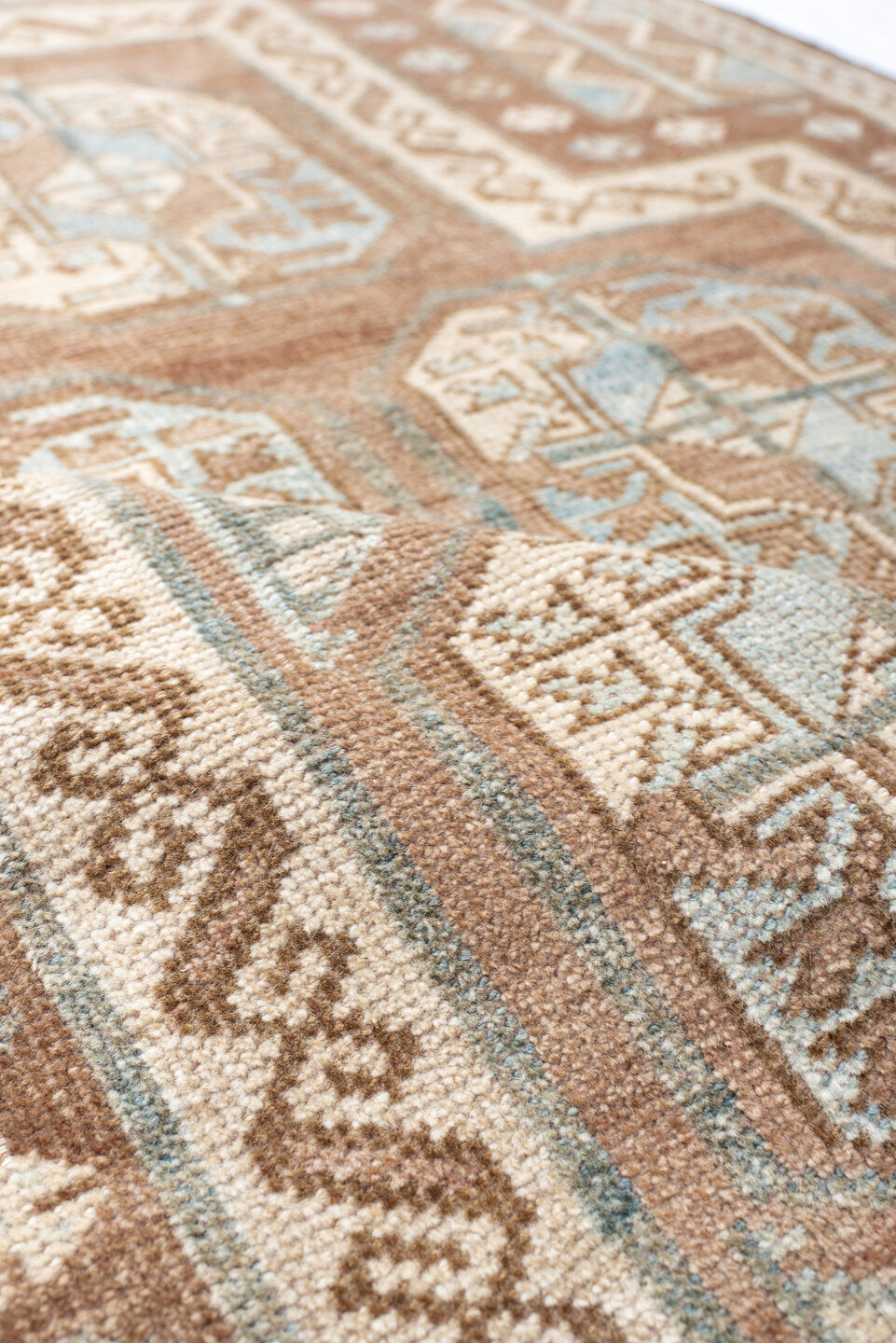 3' x 4' one-of-a-kind handmade vintage Belouch small size rug. Color palette: camel, ivory, pale blue, taupe, brown, beige