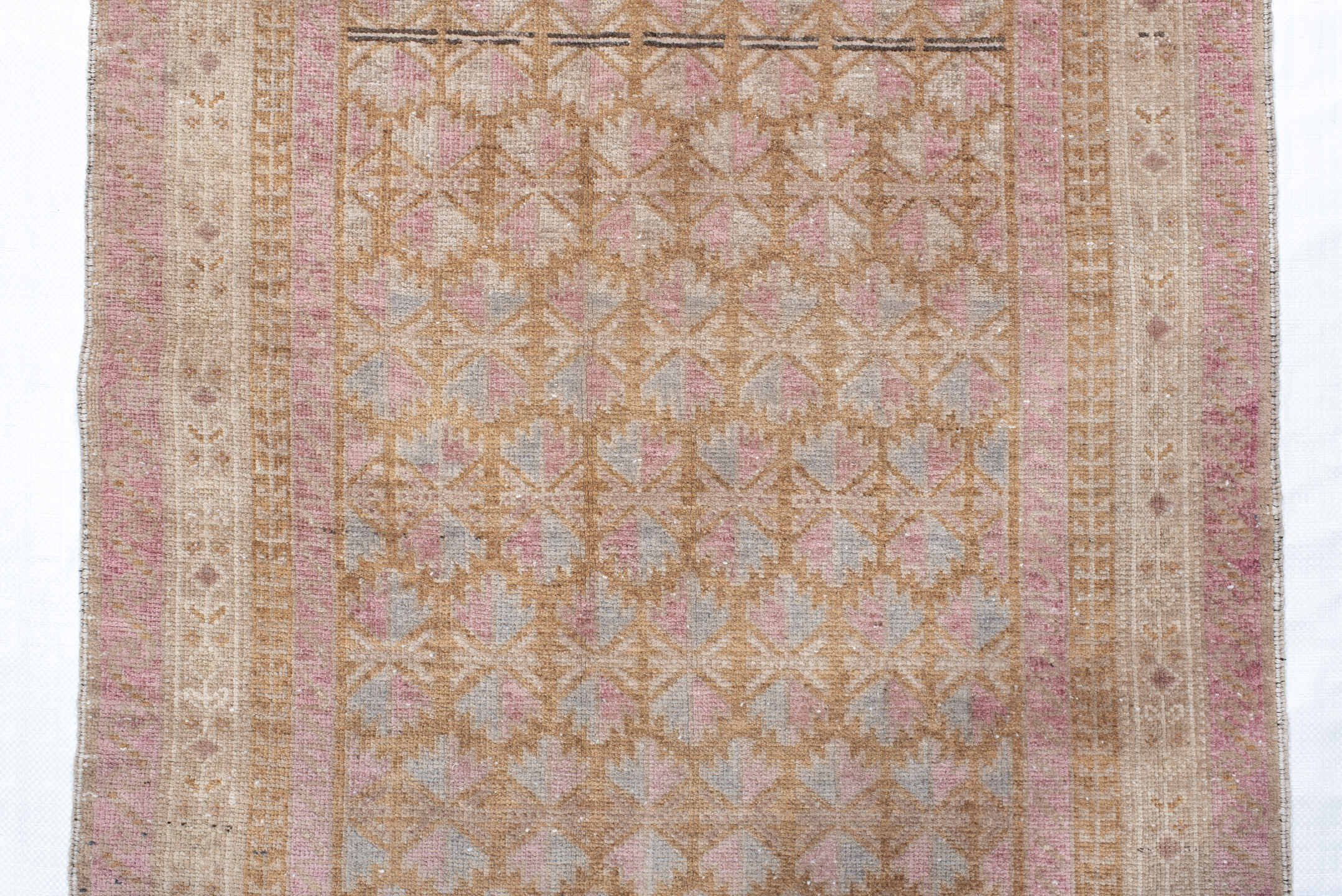 2' x 4' one-of-a-kind handmade vintage Belouch small size rug. Color palette: ivory, blush, camel, taupe, dusty rose