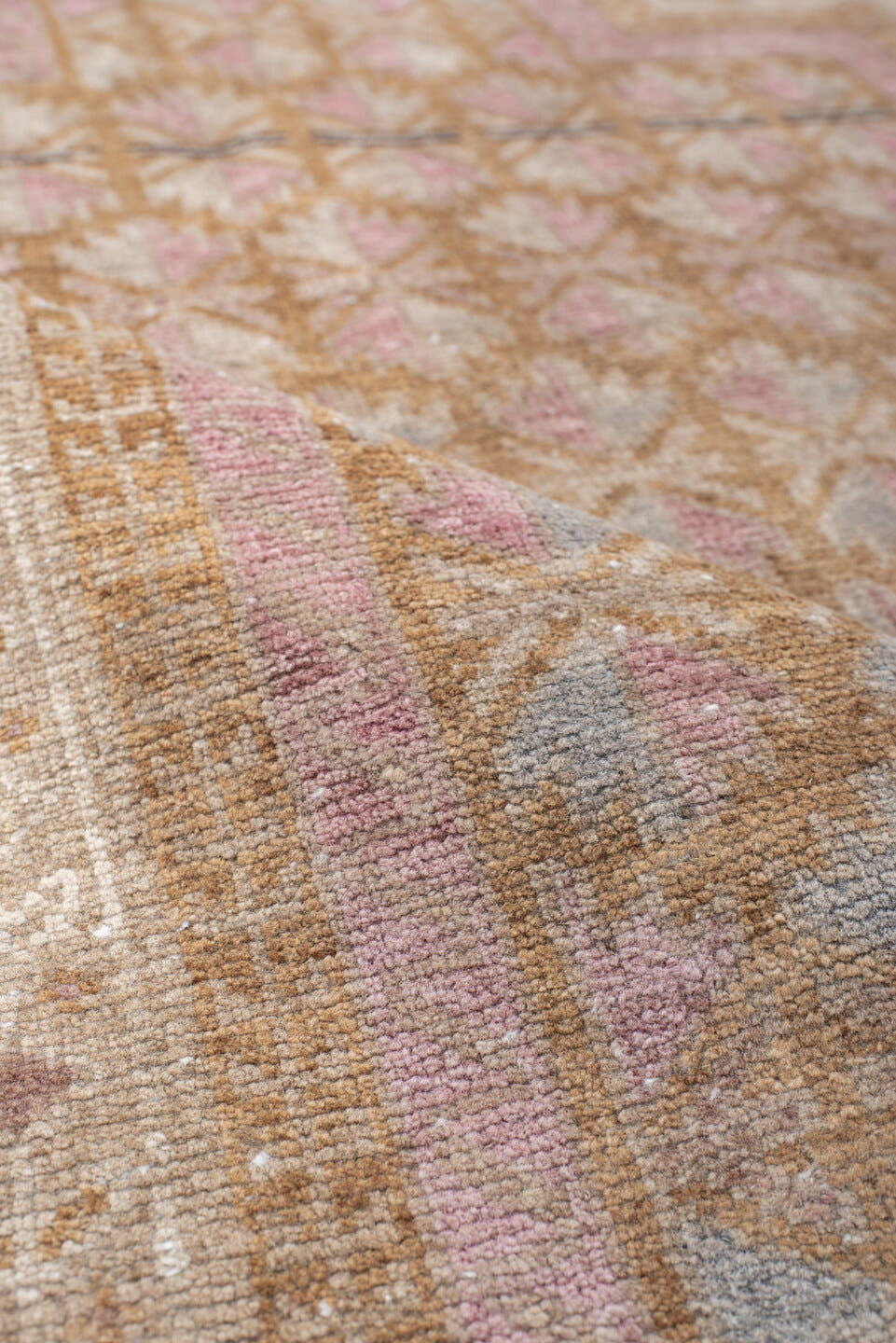 2' x 4' one-of-a-kind handmade vintage Belouch small size rug. Color palette: ivory, blush, camel, taupe, dusty rose