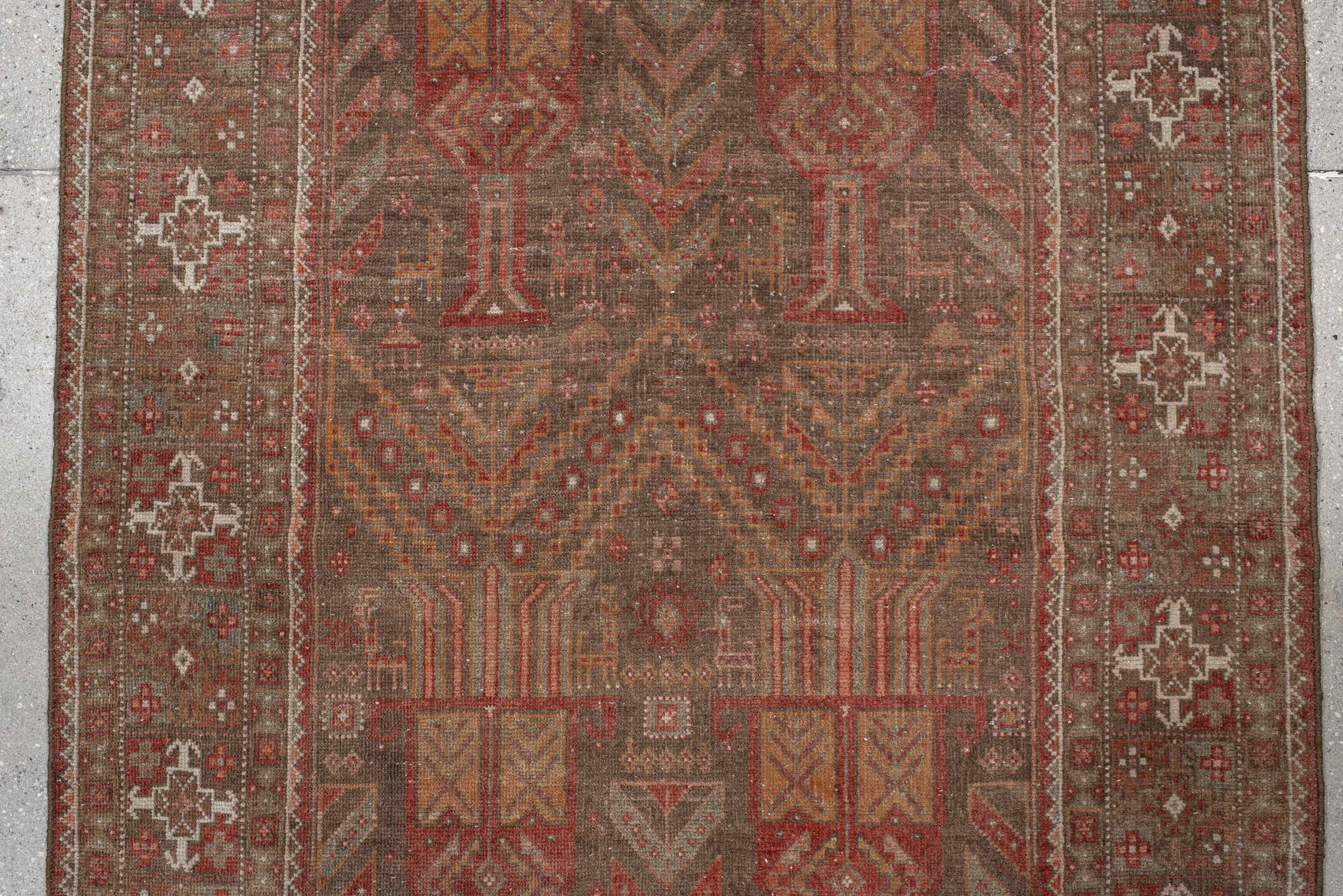 3' x 9' one-of-a-kind handmade vintage Belouch runner rug. Color palette: brown, gray, orange, pink, red