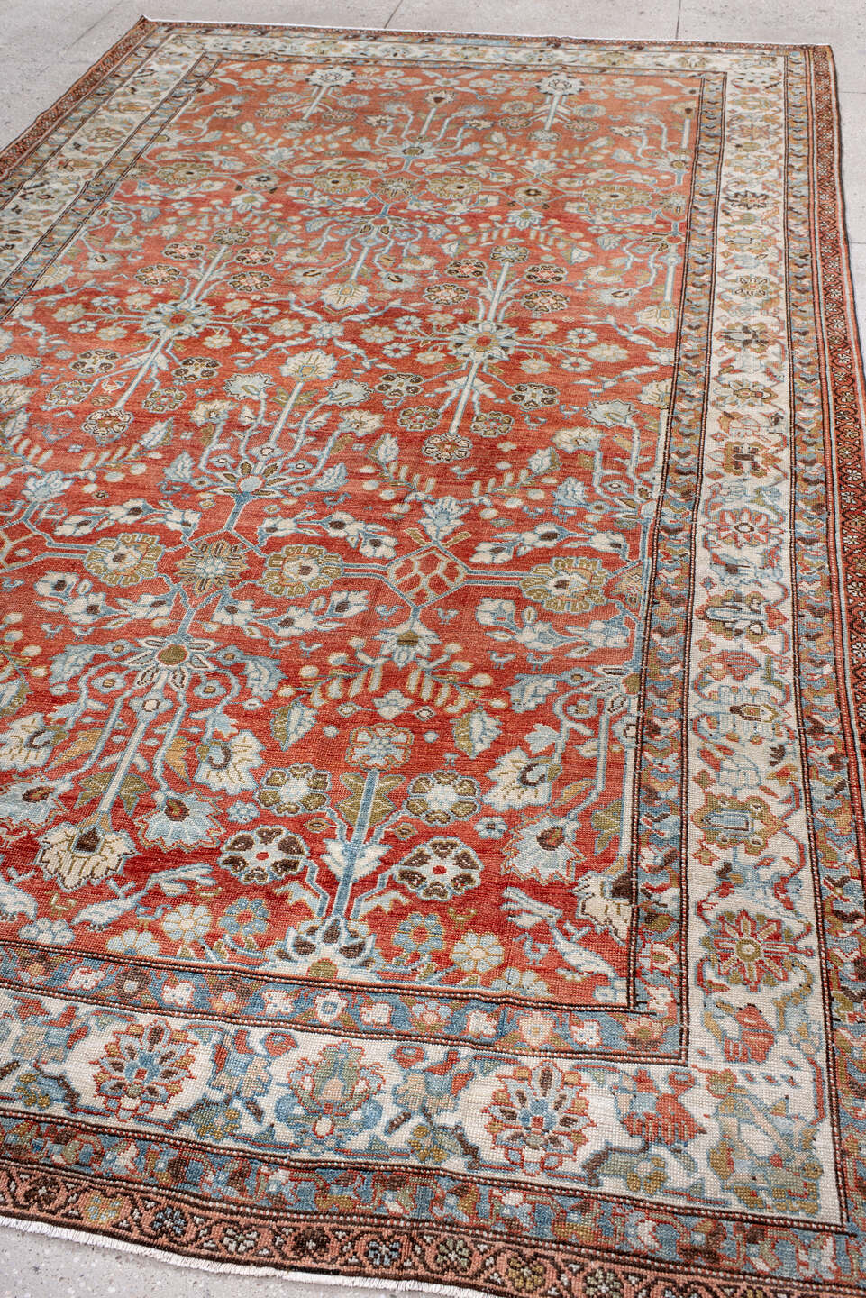 7' x 12' one-of-a-kind handmade vintage Mahal large size rug. Color palette: terra cotta, ivory, sky blue, sage, gold, rust