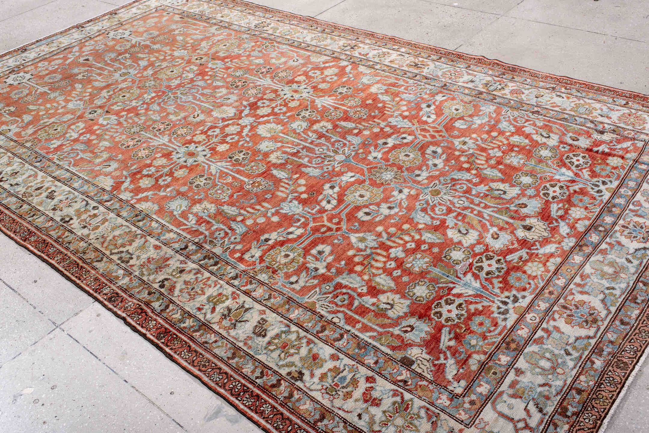 7' x 12' one-of-a-kind handmade vintage Mahal large size rug. Color palette: terra cotta, ivory, sky blue, sage, gold, rust