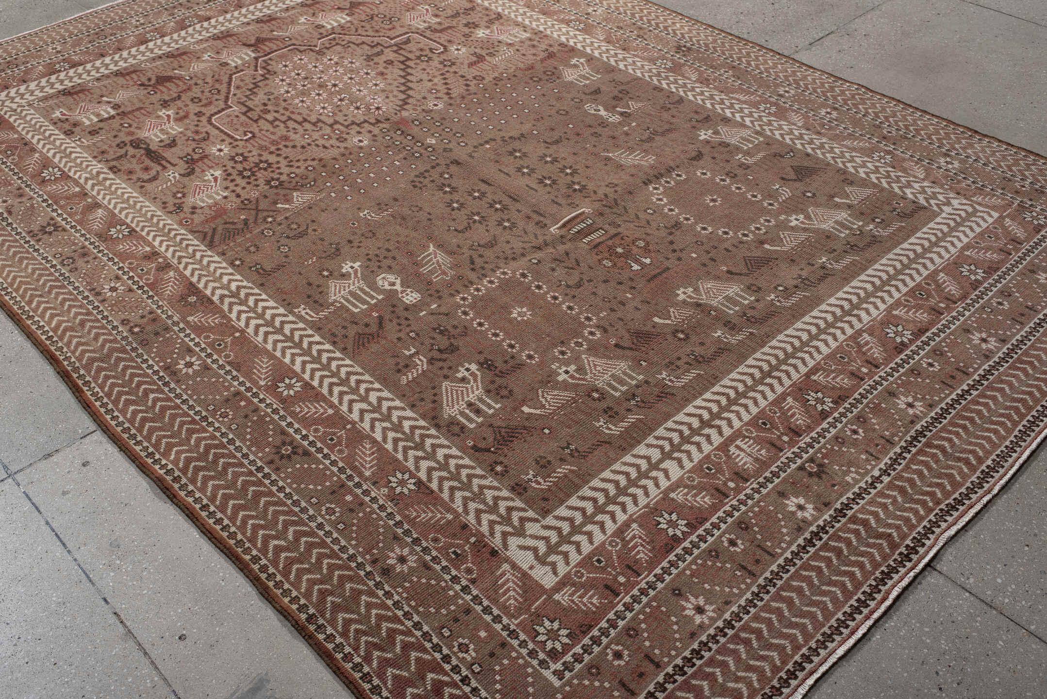 6' x 9' one-of-a-kind handmade vintage Sivas medium size rug. Color palette: brown, gray, light gray, off-white, pink