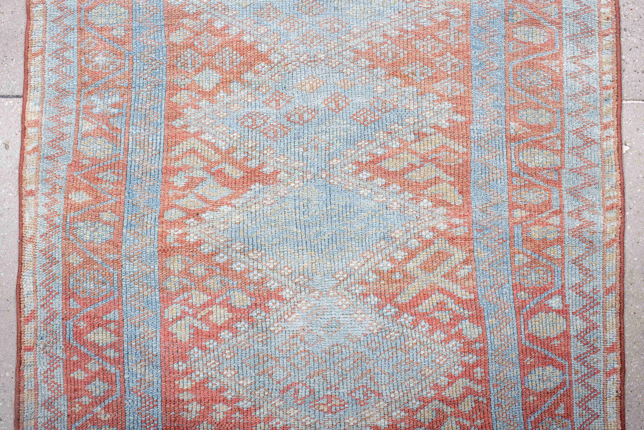 3' x 9' one-of-a-kind handmade antique Kurd runner rug. Color palette: ivory, sky blue, coral, rust, pale blue, salmon