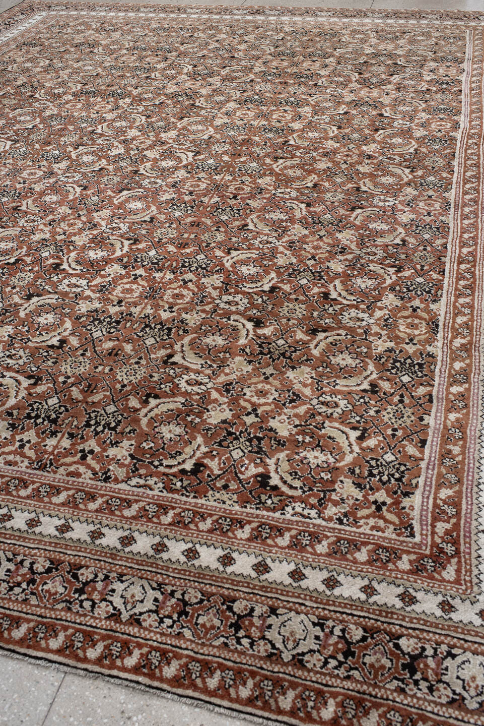 12' x 15' one-of-a-kind handmade antique Agra oversize rug. Color palette: terra cotta, ivory, charcoal, taupe, brown, camel