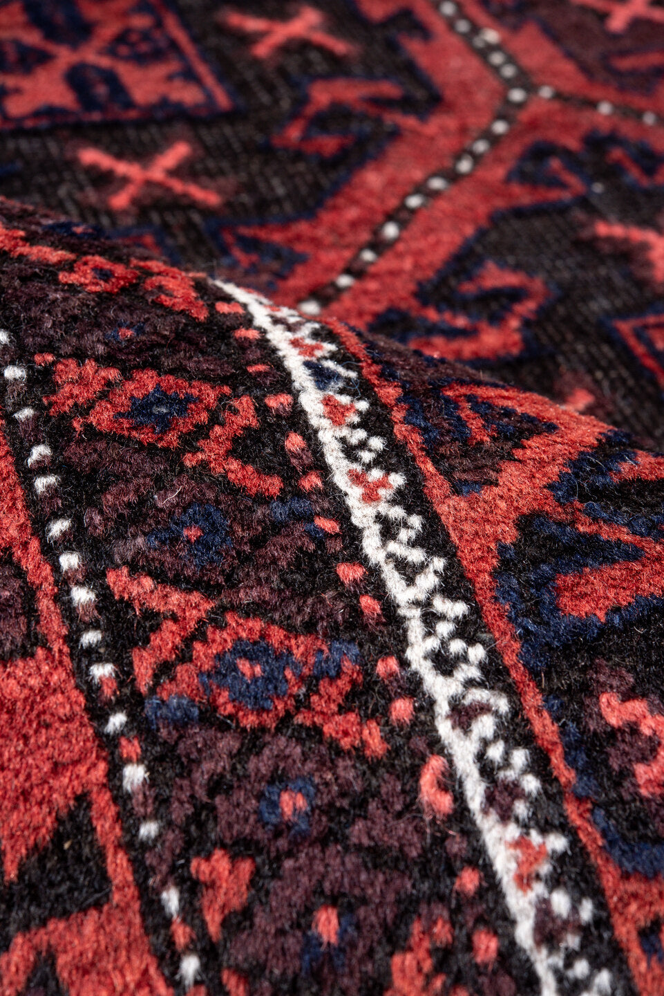 3' x 6' one-of-a-kind handmade vintage Belouch small size rug. Color palette: brown, gray, light coral, light gray, pink