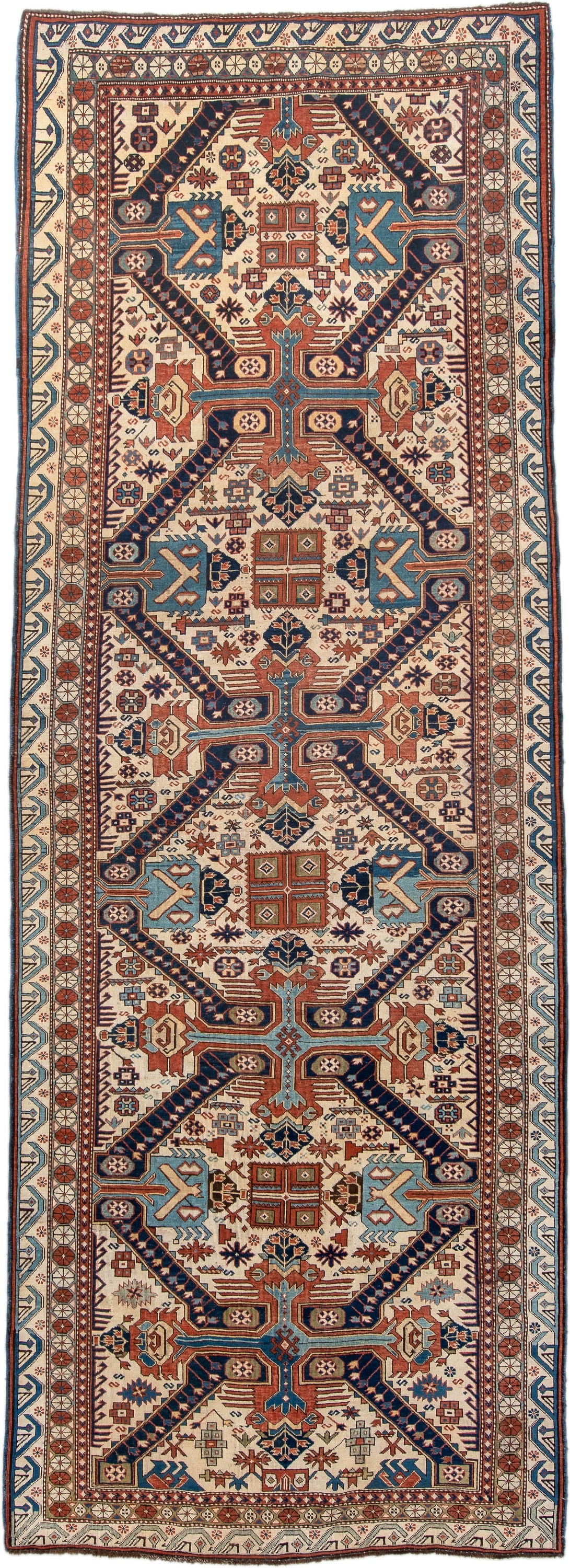 4' x 11' one-of-a-kind handmade antique Caucasian runner rug. Color palette: ivory, indigo, rust, sky blue, navy, camel