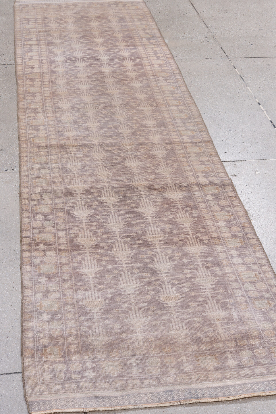 2' x 9' one-of-a-kind handmade antique Belouch runner rug. Color palette: taupe, ivory, dusty rose, beige, camel