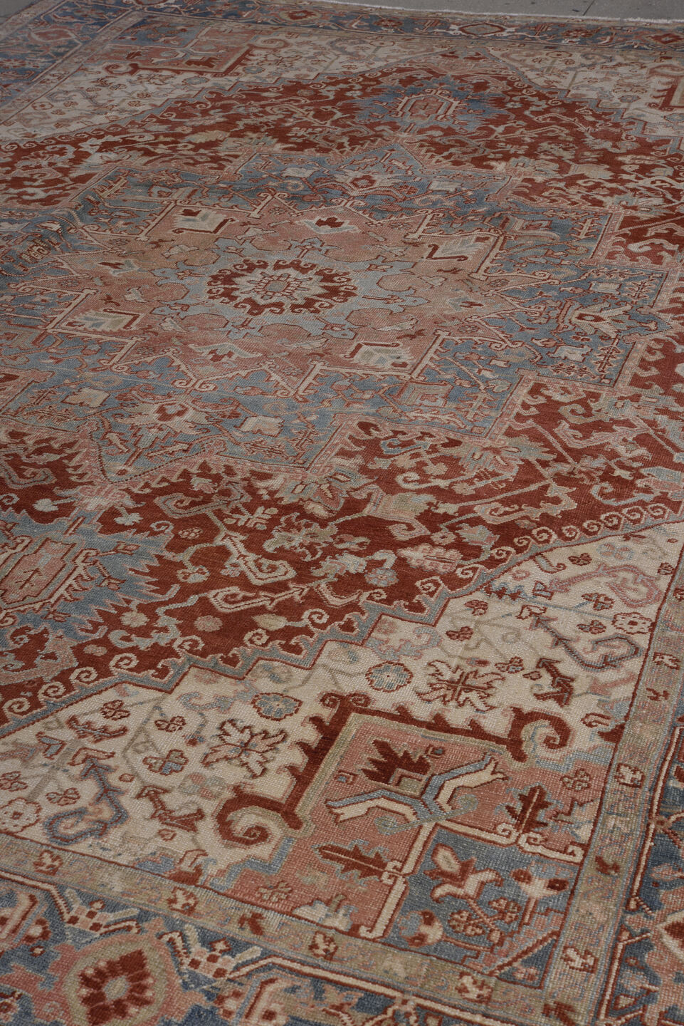 8' x 11' one-of-a-kind handmade antique Heriz large size rug. Color palette: ivory, rust, sky blue, blush, terra cotta