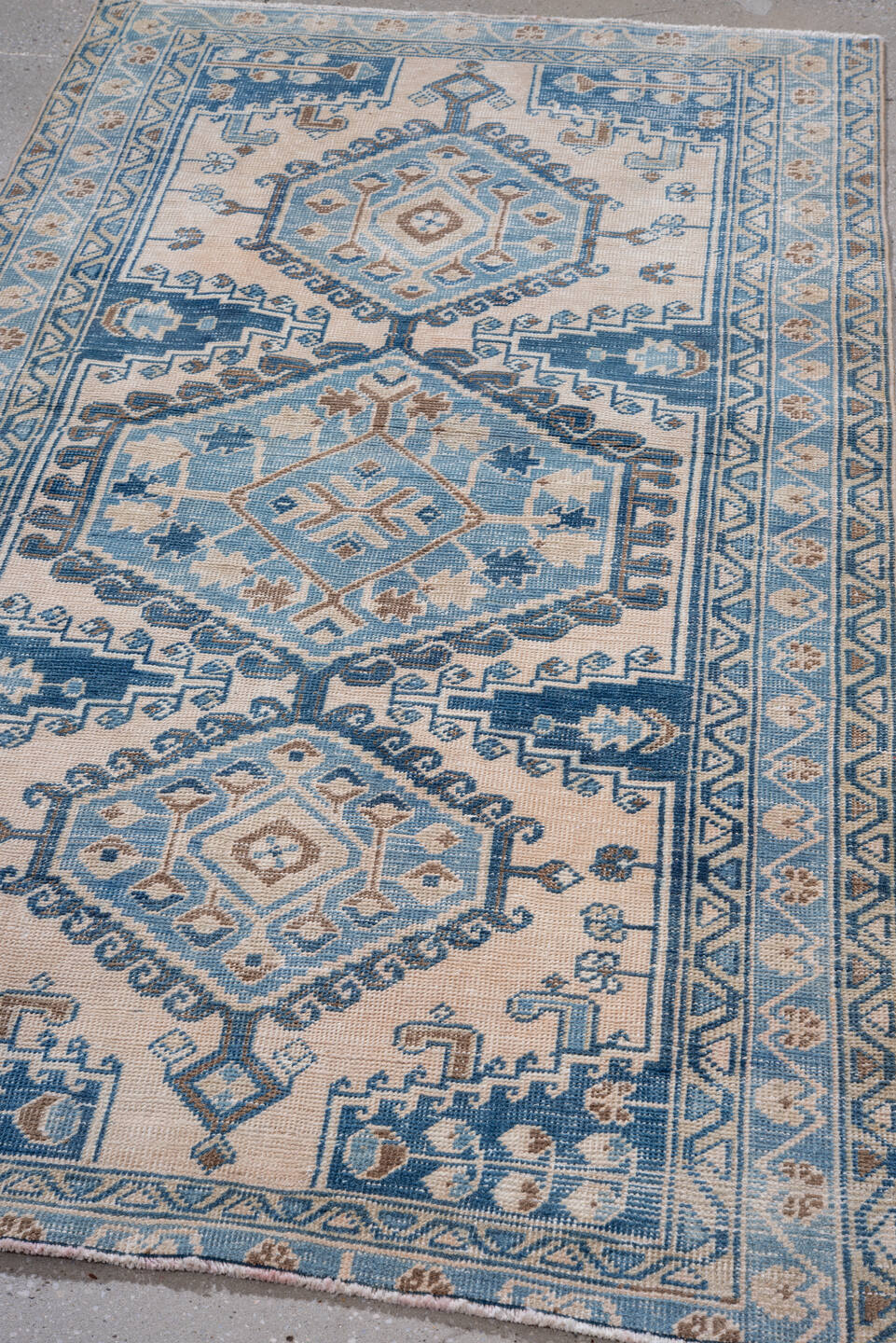 3' x 6' one-of-a-kind handmade vintage Veece small size rug. Color palette: ivory, sky blue, camel, navy, taupe, light blue