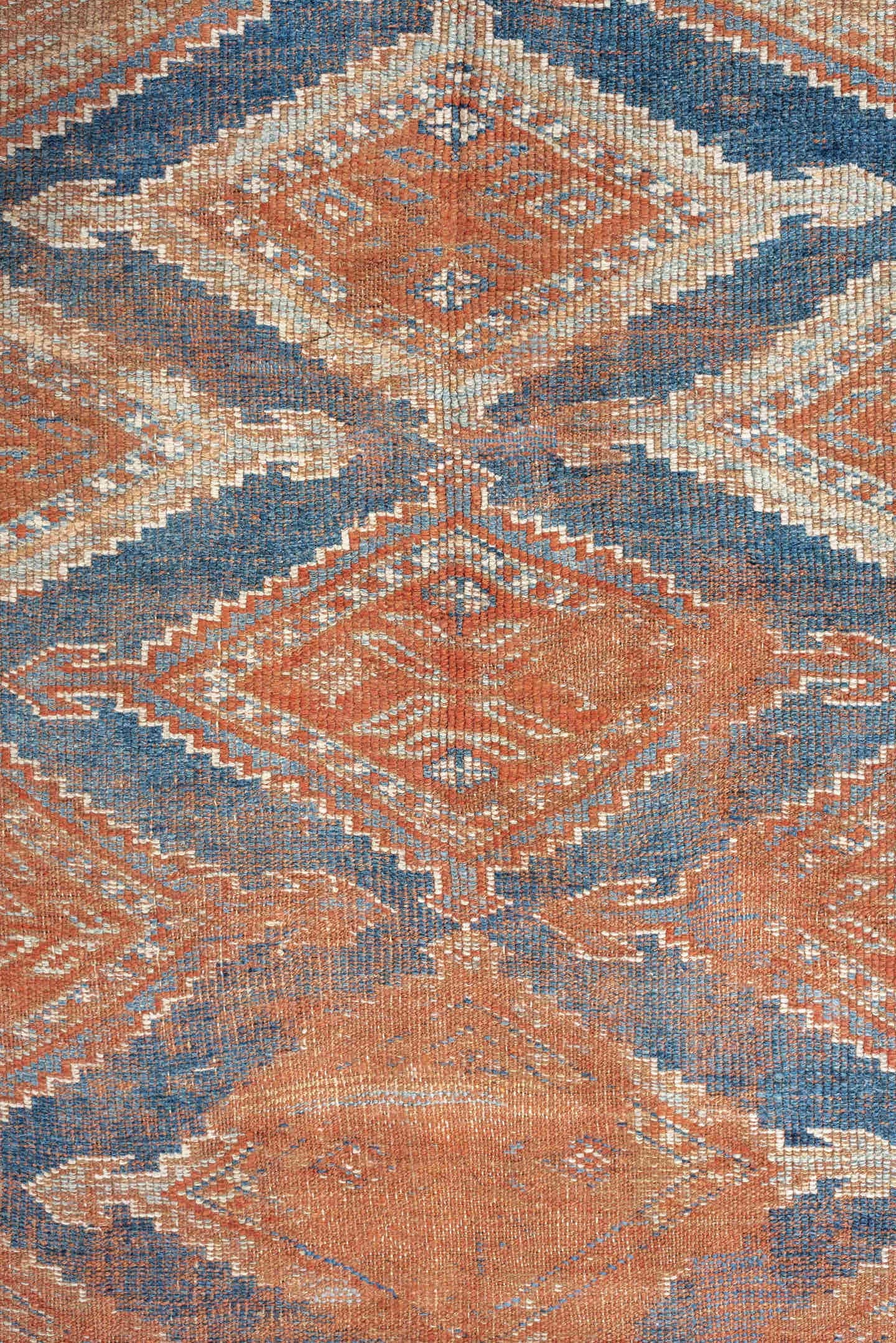 4' x 7' one-of-a-kind handmade antique Kurd rug. Color palette: terracotta, powder blue, ivory, camel, taupe, rust, brown