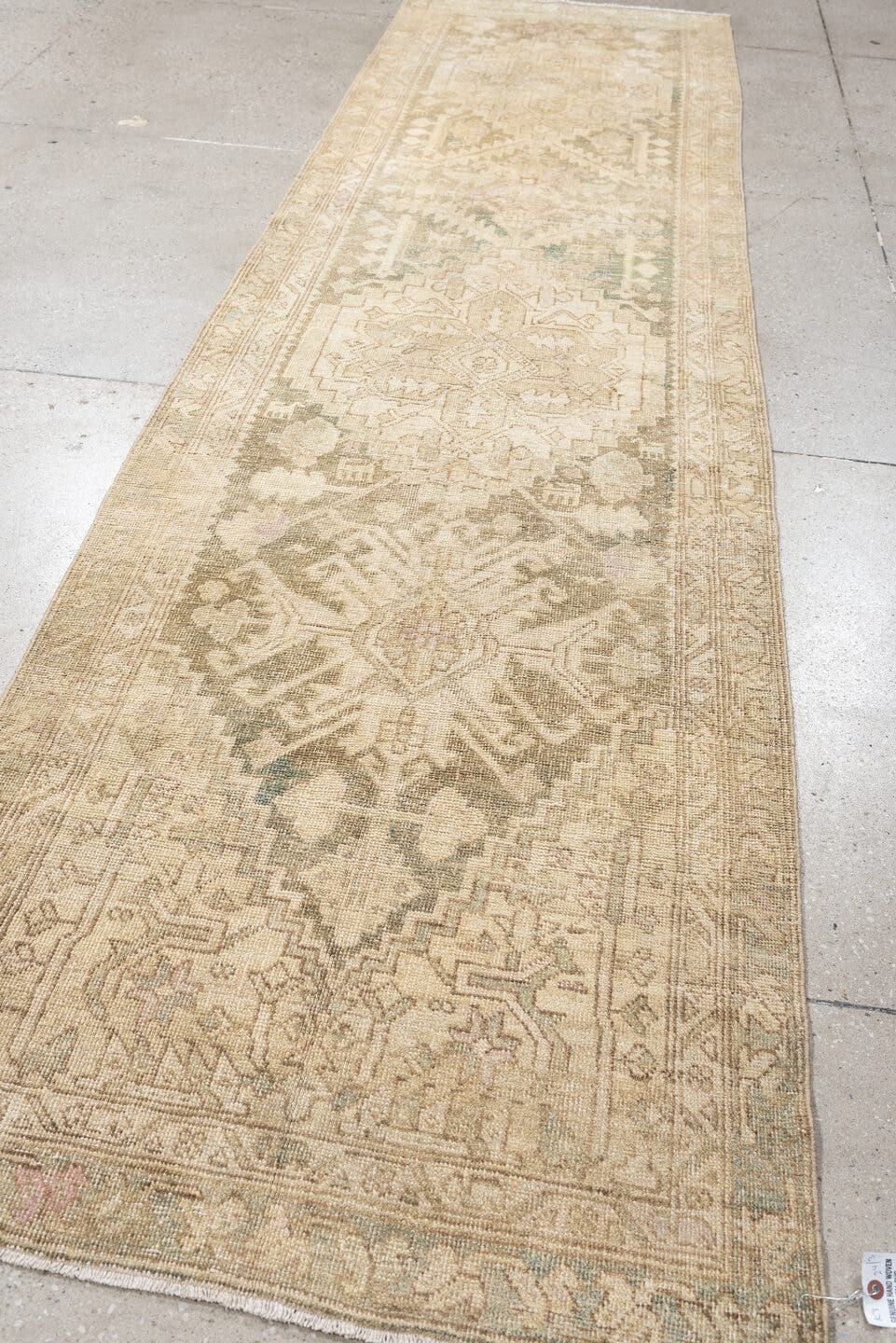 2' x 11' one-of-a-kind handmade antique Sarab runner rug. Color palette: ivory, taupe, beige, sage, pale rust, camel, brown