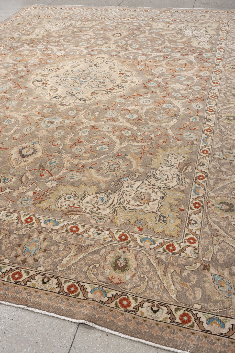 9' x 12' one-of-a-kind handmade vintage Tabriz large size rug. Color palette: taupe, ivory, camel, pale blue, rust, cream