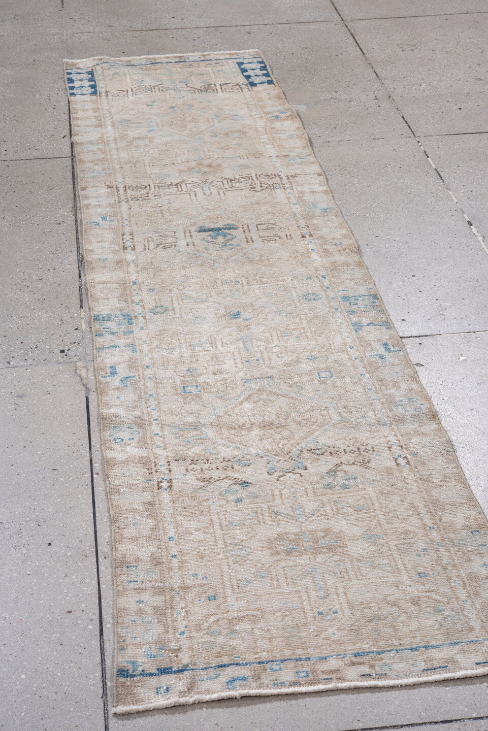 2' x 8' one-of-a-kind handmade vintage Karaje runner rug. Color palette: ivory, taupe, sky_blue, beige, slate_blue, camel