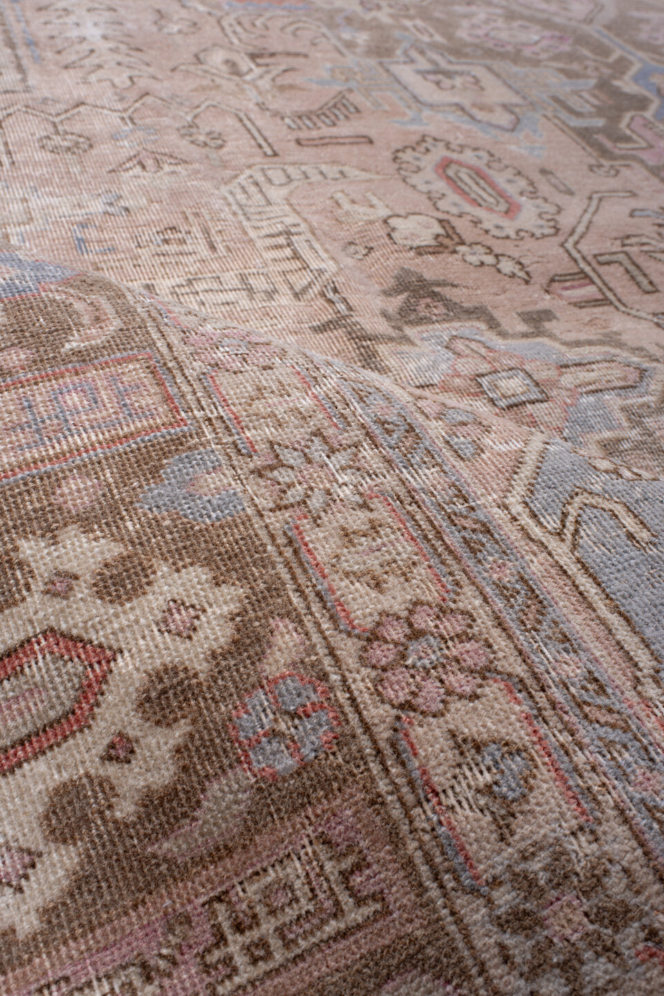 7' x 11' one-of-a-kind handmade antique Heriz large size rug. Color palette: taupe, rose, dusty blue, ivory, brown