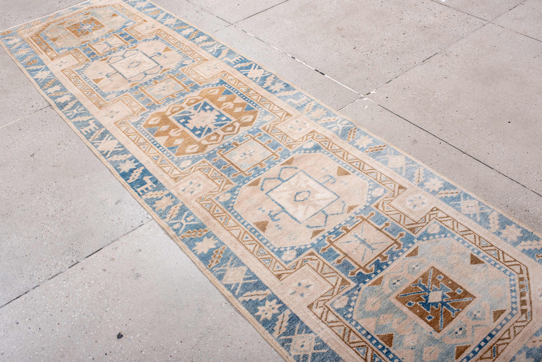 2' x 10' one-of-a-kind handmade antique Heriz runner rug. Color palette: ivory, sky blue, camel, light blue, taupe, brown