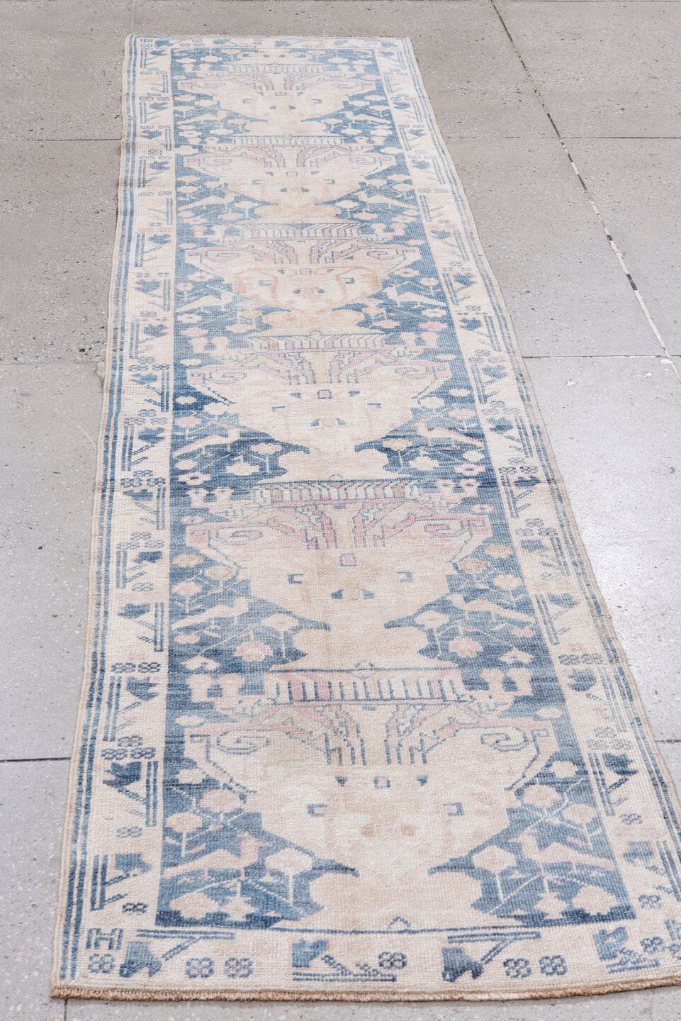 2' x 9' one-of-a-kind handmade antique Anatolian runner rug. Color palette: ivory, pale blue, blush, slate, cream