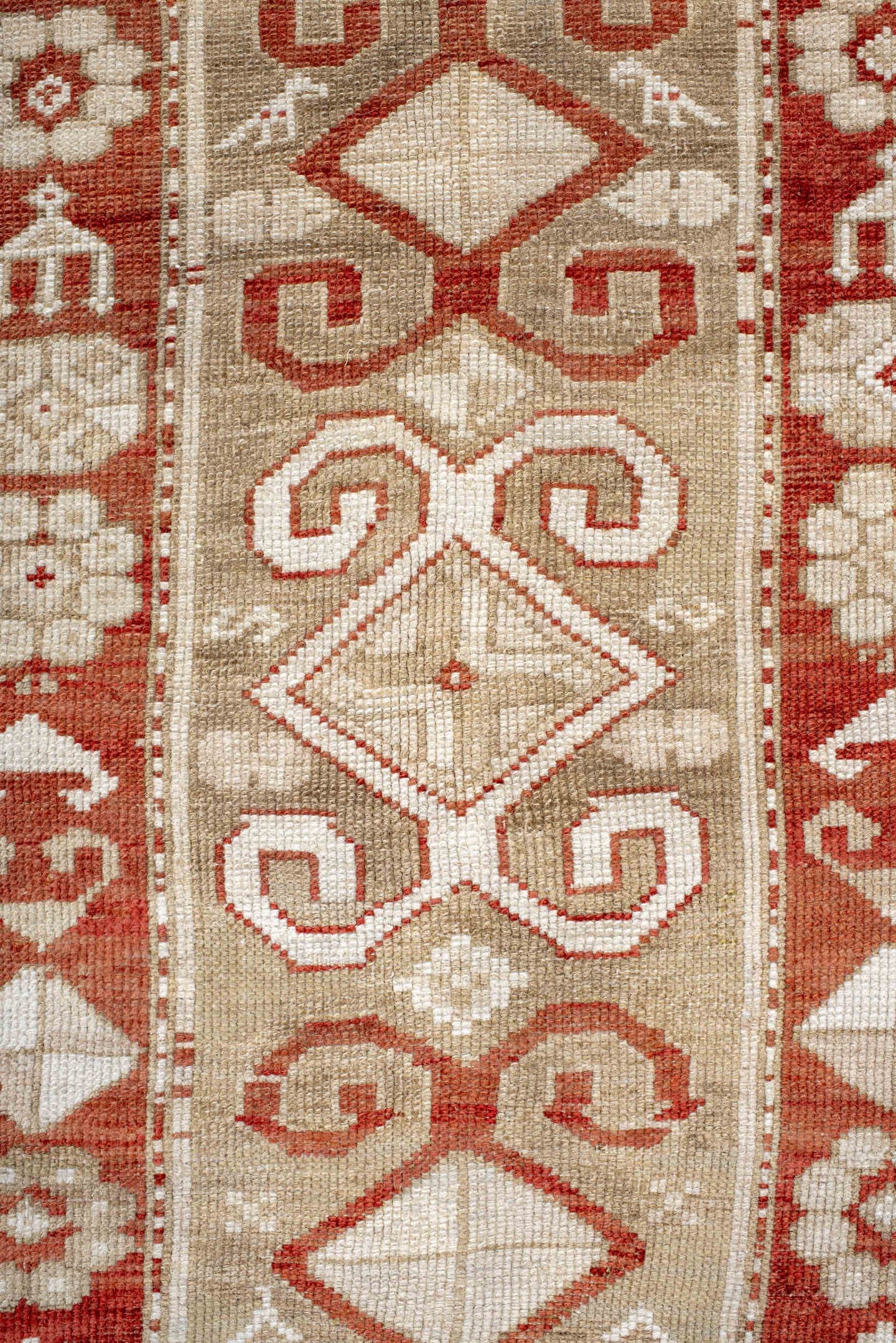 4' x 9' one-of-a-kind handmade antique Caucasian runner rug. Color palette: ivory, rust, camel, brick, beige, terracotta