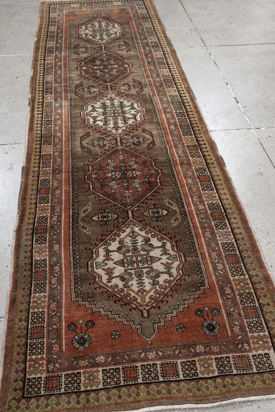 3' x 10' one-of-a-kind handmade antique Sarab runner rug. Color palette: taupe, camel, rust, ivory, brown, sage, slate
