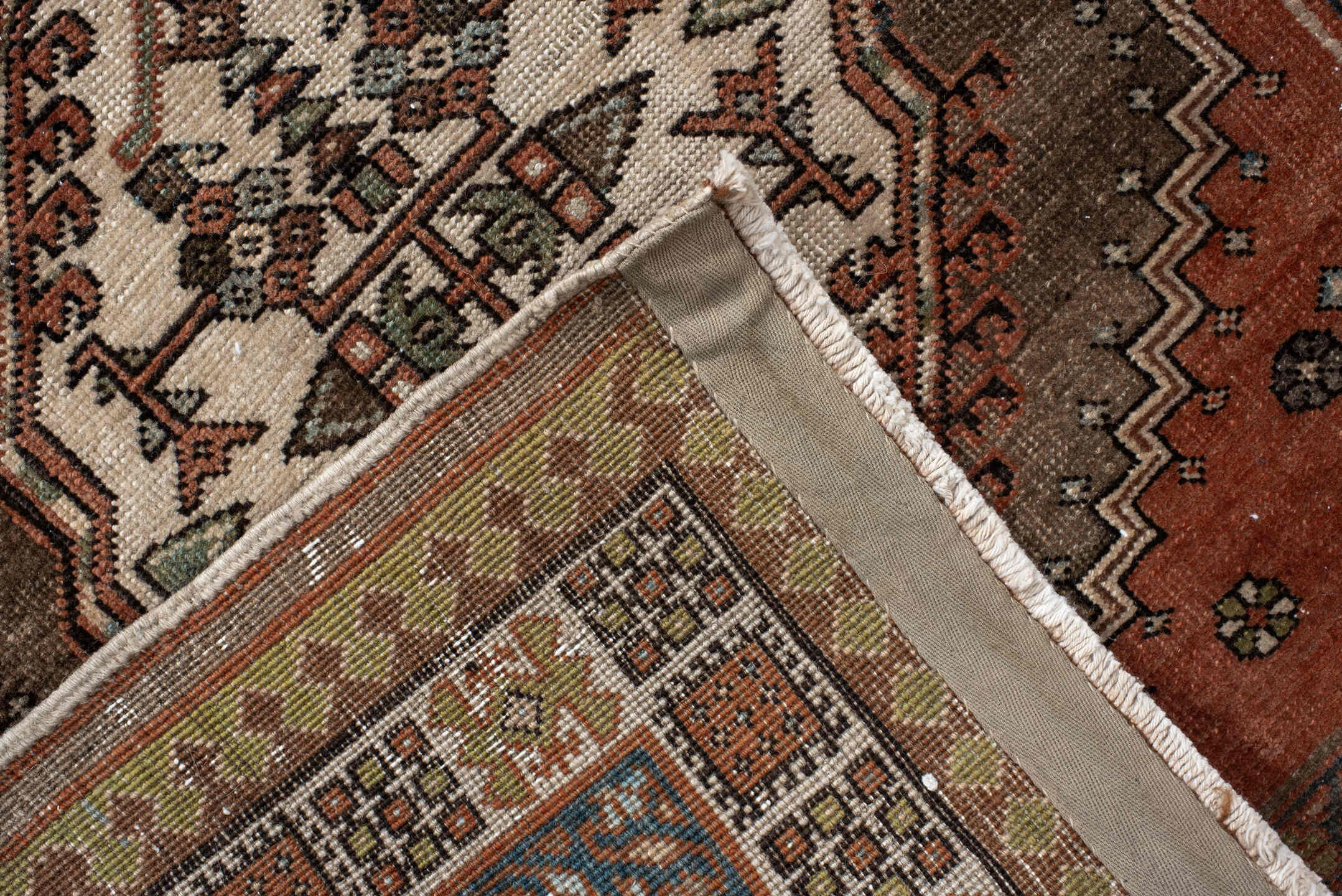 3' x 10' one-of-a-kind handmade antique Sarab runner rug. Color palette: taupe, camel, rust, ivory, brown, sage, slate