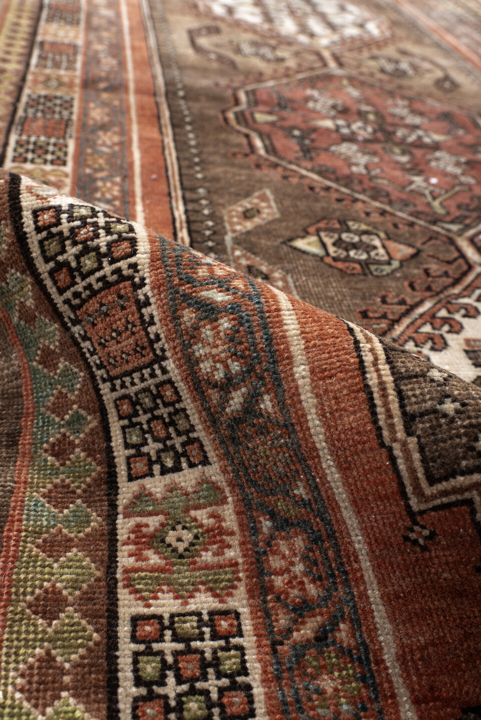 3' x 10' one-of-a-kind handmade antique Sarab runner rug. Color palette: taupe, camel, rust, ivory, brown, sage, slate