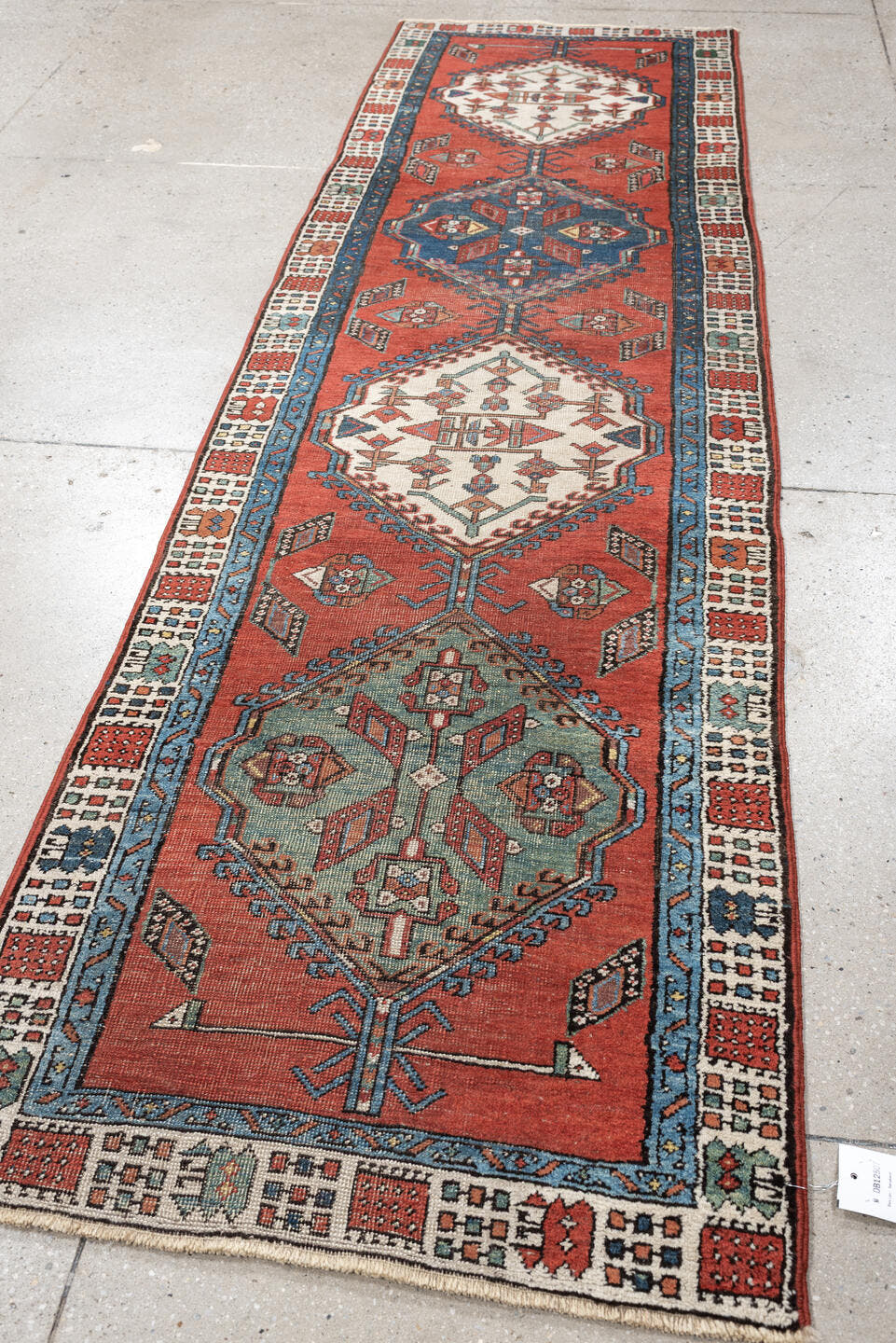 2' x 9' one-of-a-kind handmade vintage Saraband runner rug. Color palette: terra cotta, ivory, blue, rust, slate, sage