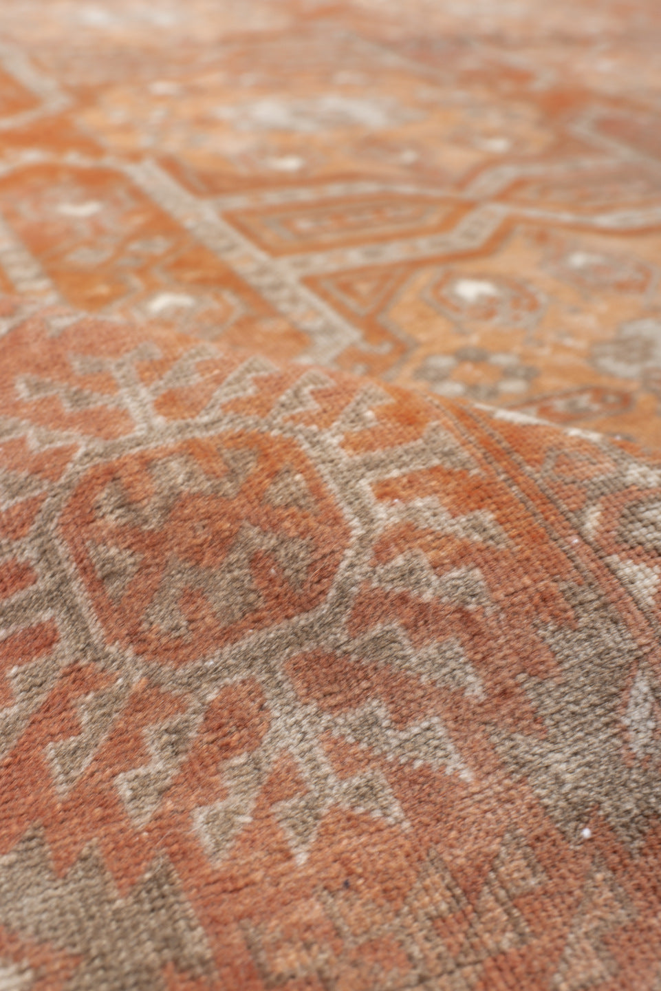 5' x 8' one-of-a-kind handmade vintage Bokara medium size rug. Color palette: brown, gray, light gray, off-white, orange