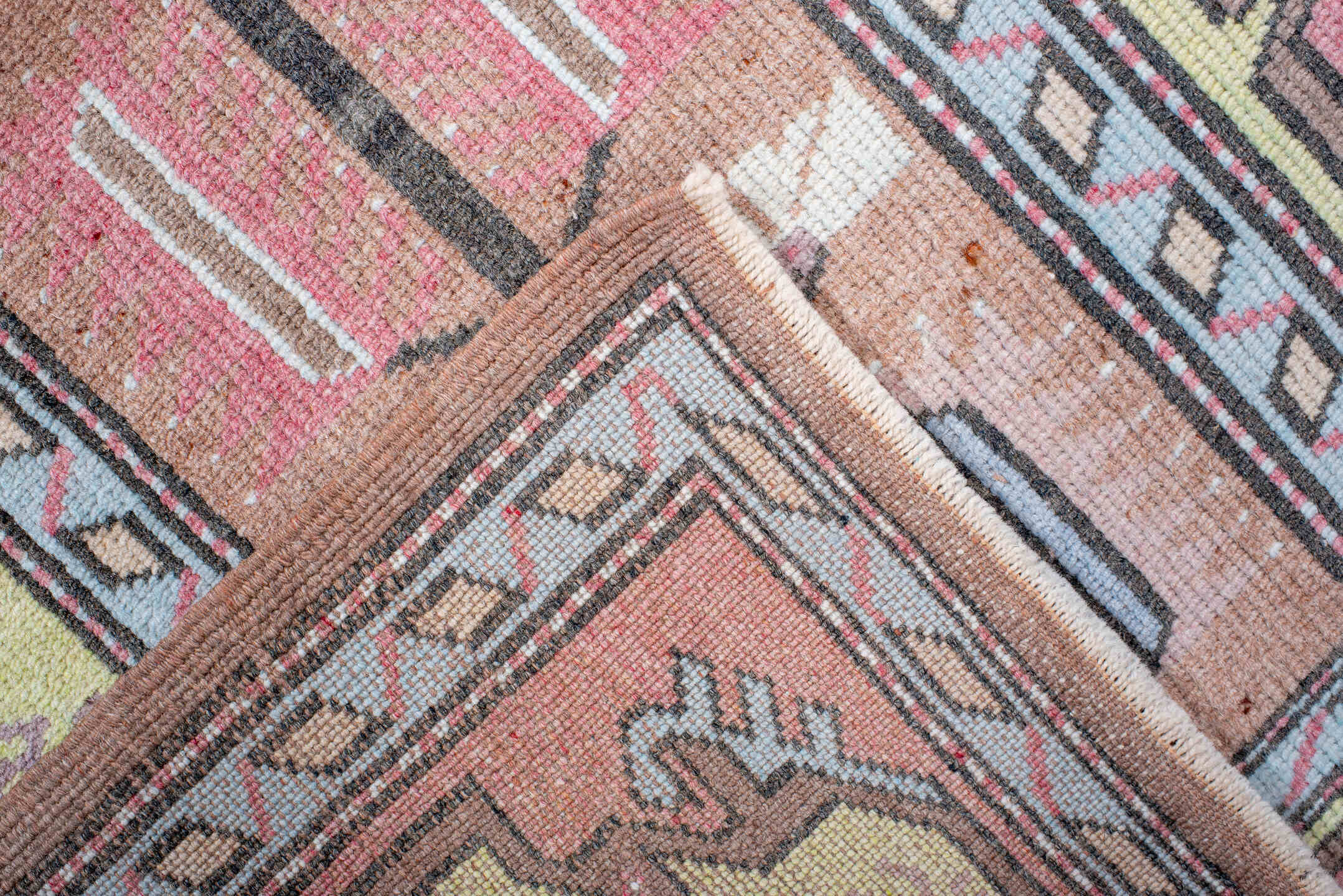 2' x 4' one-of-a-kind handmade antique Anatolian small size rug. Color palette: blush, pale_yellow, sky_blue, brown, ivory